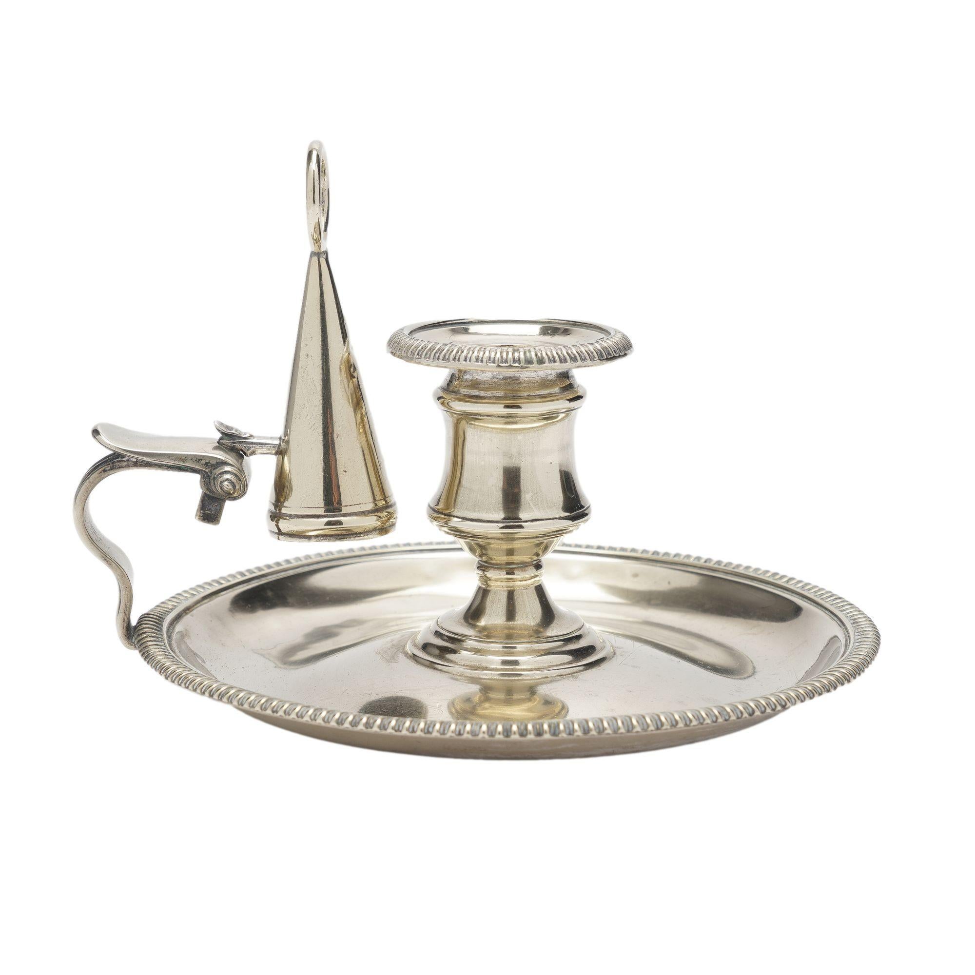 Cast paktong chamber candlestick with attached candle snuffer. Thomas Watson impressed hatchment on the underside.
England, c. 1810.