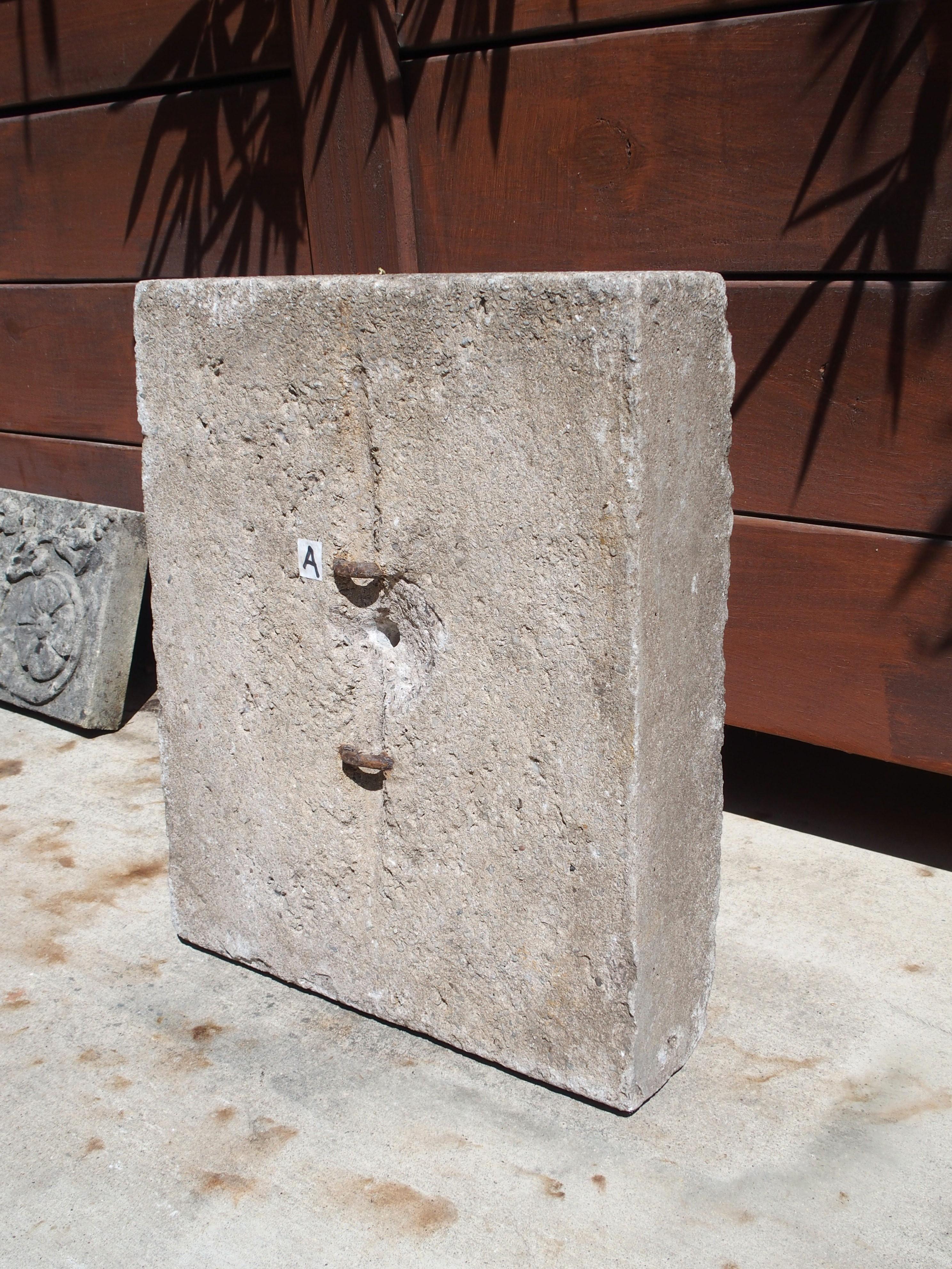 This thick cast stone lion mascaron fountain spout is from England and dates to the 1960s. Cast stone is an aggregate of crushed stone and concrete, in this case, mixed with a stone gray coloring agent that gives the lion its color. Areas of the