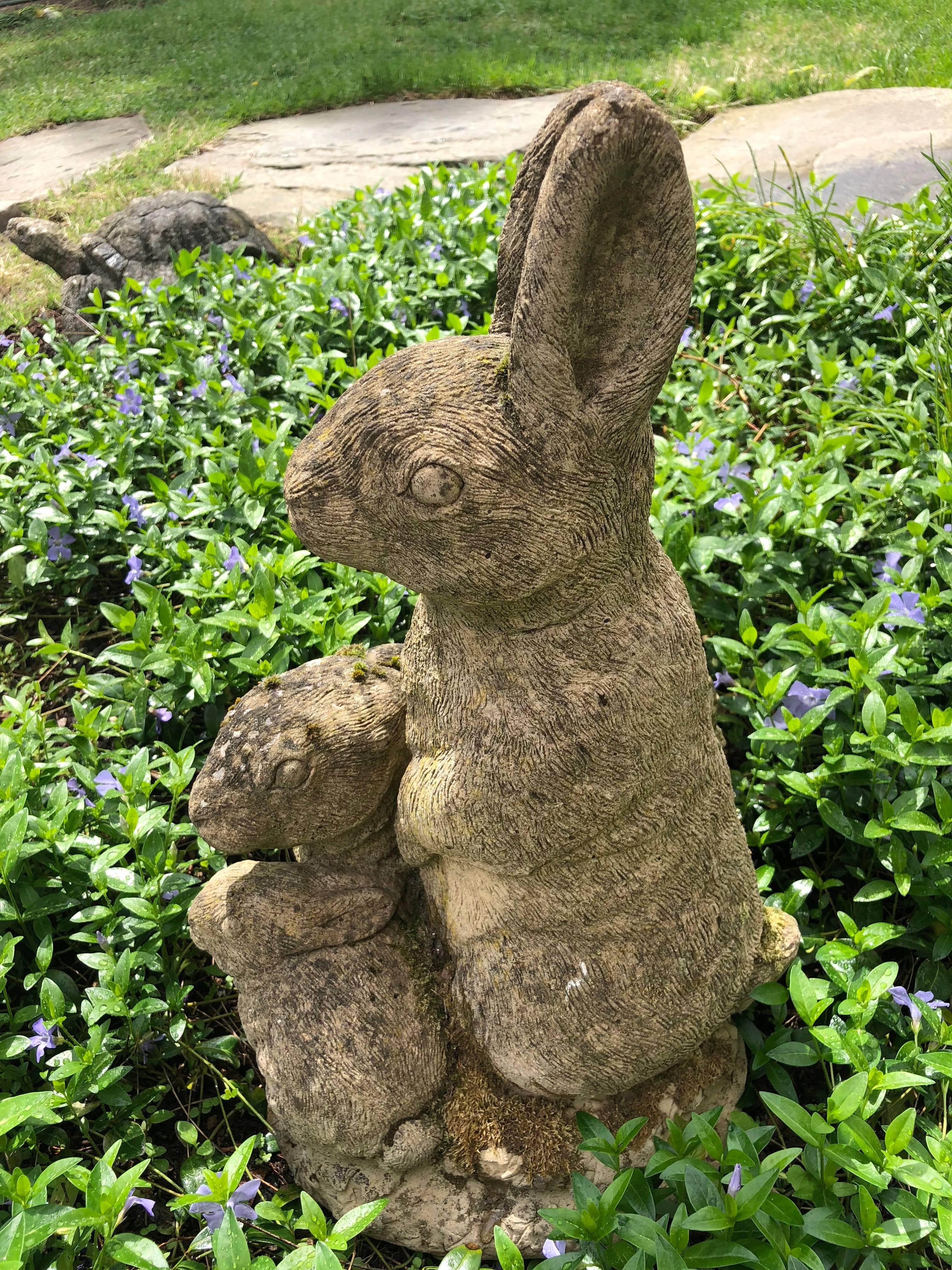 This cast stone figure of a Mama bunny with her two little ones is simply adorable. She has an alert expression, while the two babies are cuddled in closely around her feet. Loaded with moss, this figure would be perfect in an herb or cutting