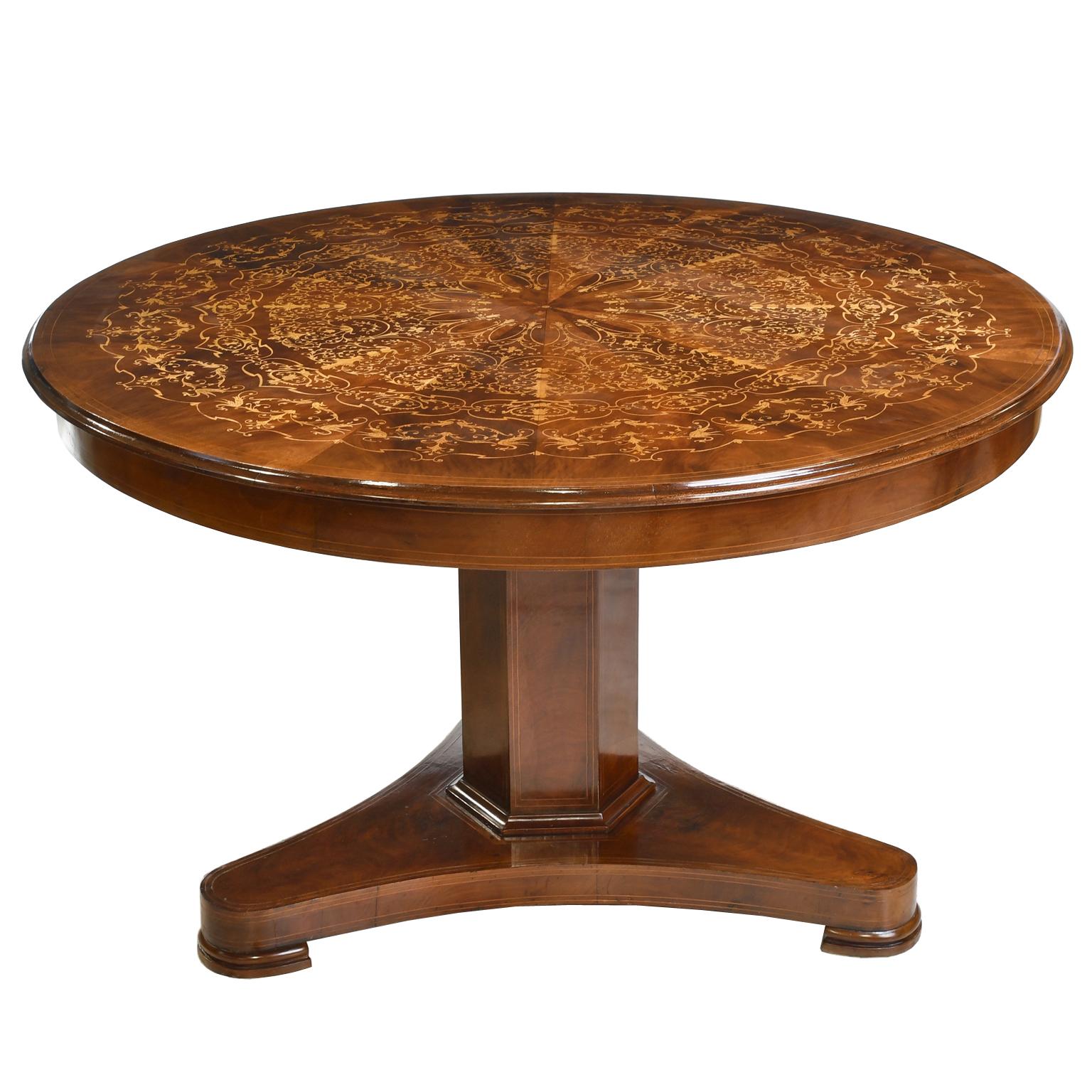 An exceptional tilt-top English Regency loo table or center table in fine West Indies mahogany with round top embellished with fine marquetry inlays in mahogany & satinwood. Tilt-top rests on hexagonal column with fine line inlays in satinwood over