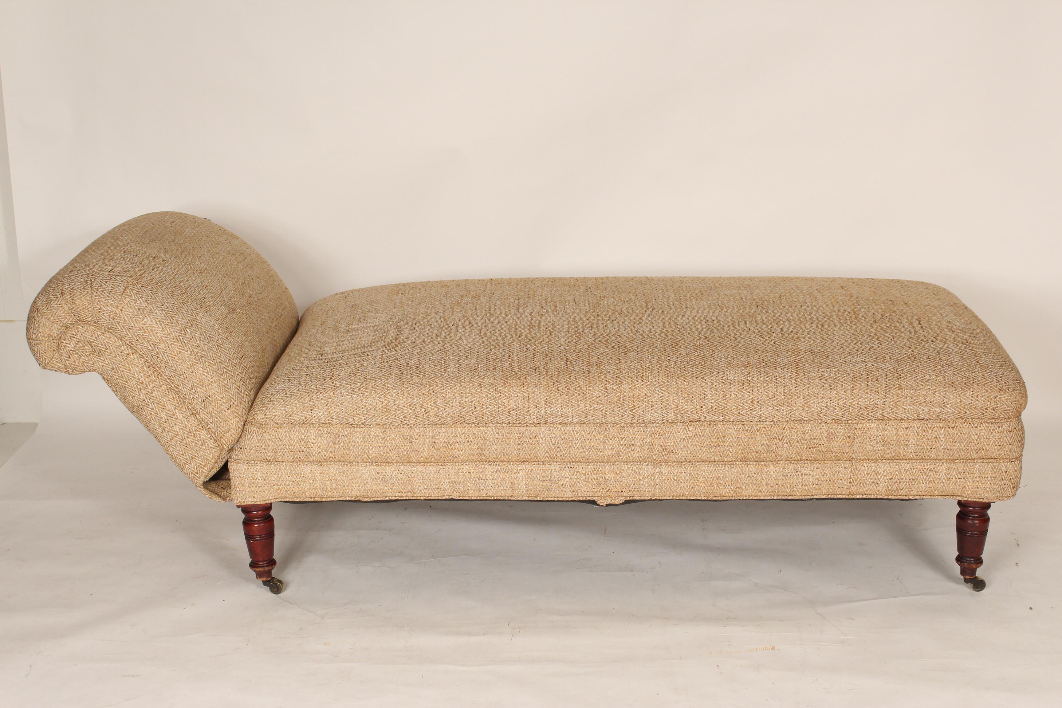 English chaise lounge with an adjustable back, mahogany legs and brass casters, late 19th century. Height of back when raised 26