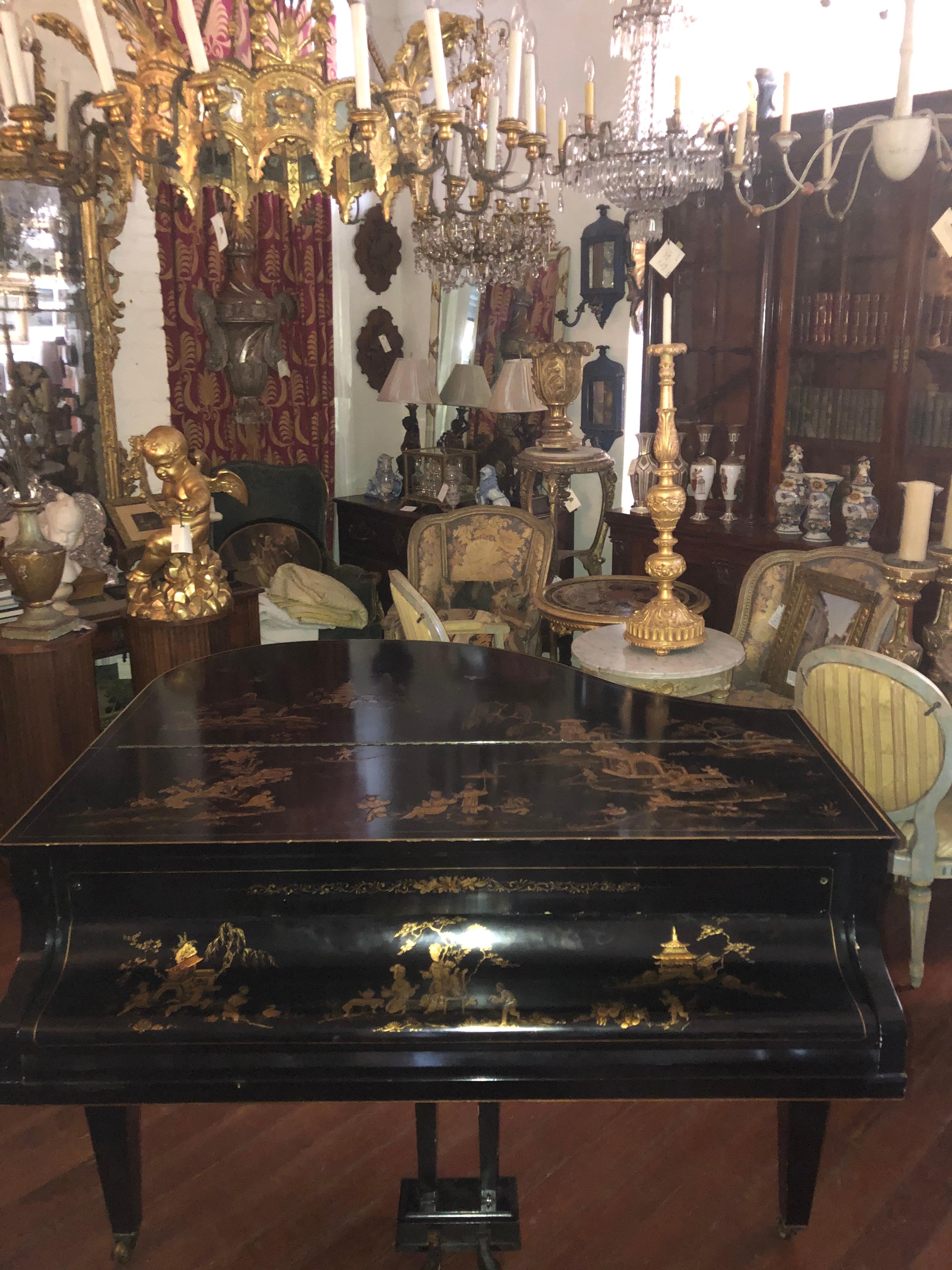 English turn of the century baby grand piano with exquisite chinoiserie decoration, gold on black Challen Piano Company was founded in 1804 in the Regency period in England. This piano was manufactured some time circa turn of the century, it holds