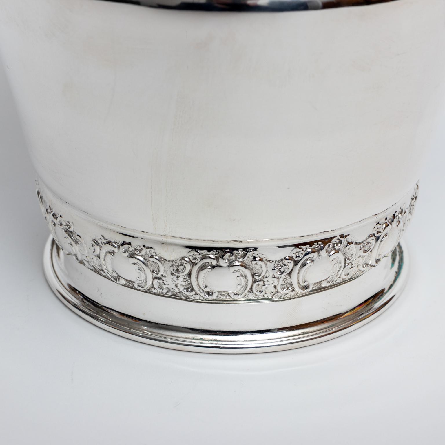 Mid-20th Century English silver plate champagne bucket or wine cooler with two bands. Please note of wear consistent with age.