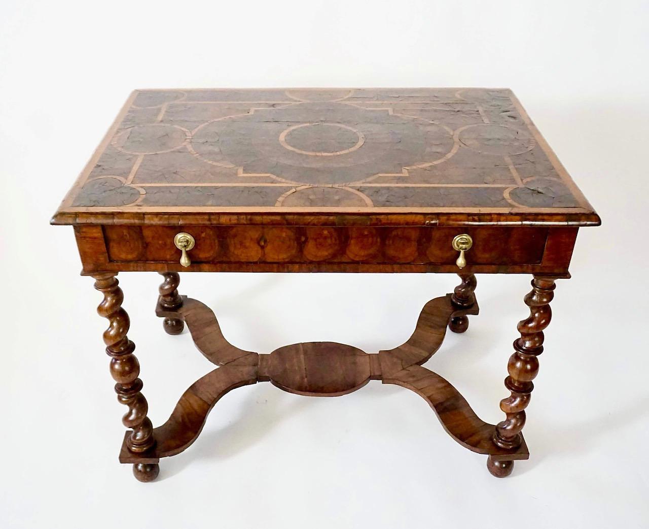 A fine English pre-William-and-Mary, circa 1680 Charles II period side table of rectangular form, the moulded-edge parquetry top inlaid with olivewood 'oystering' within geometric strapwork in holly atop oyster-frieze single drawer with original