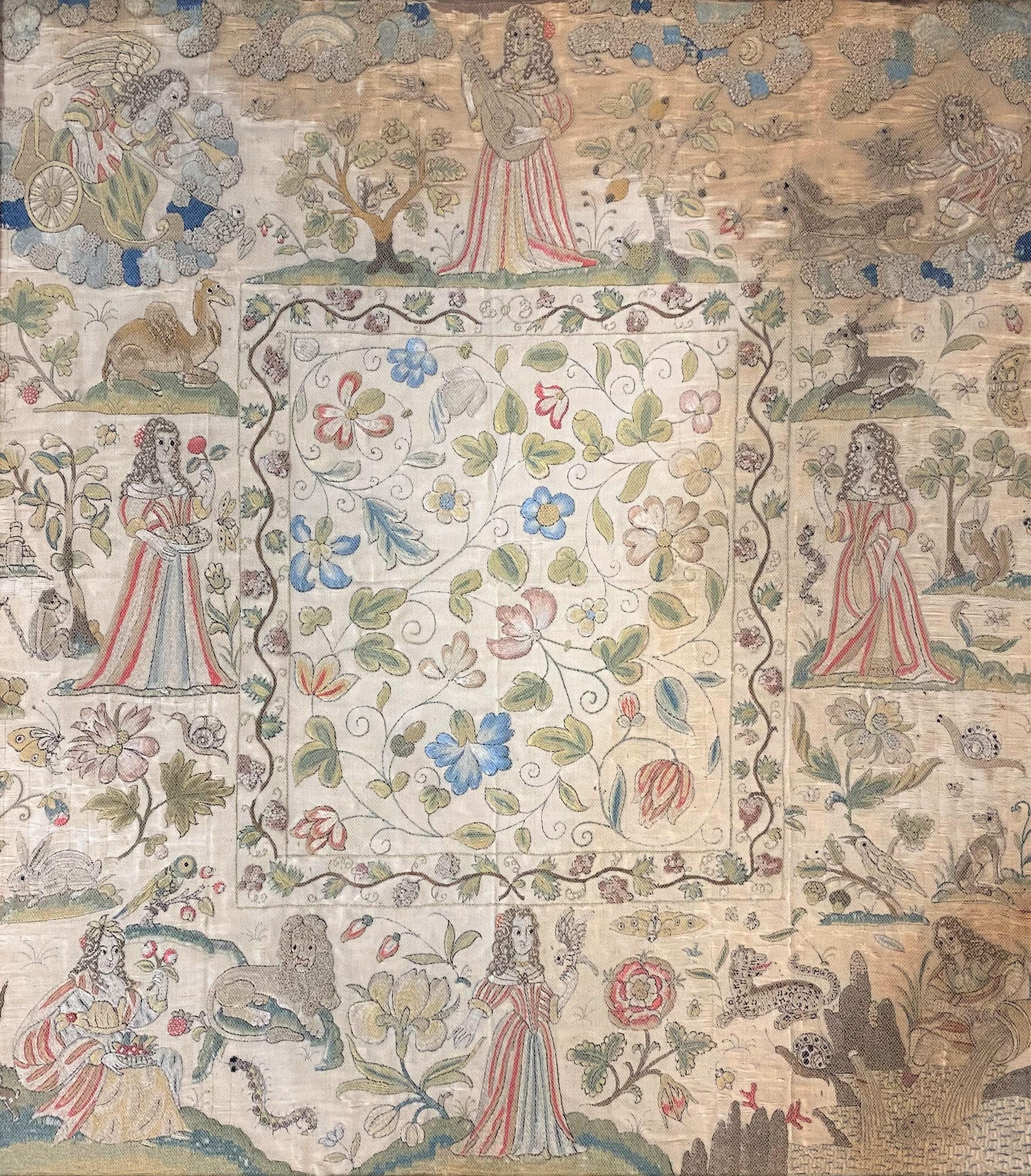 Un bel exemple d'un tableau en soie Charles II encadré sous verre, avec des personnages et des animaux dans la bordure, et une décoration feuillagée sur l'ensemble, vers 1660, en très bon état général, avec quelques légères altérations dans le
