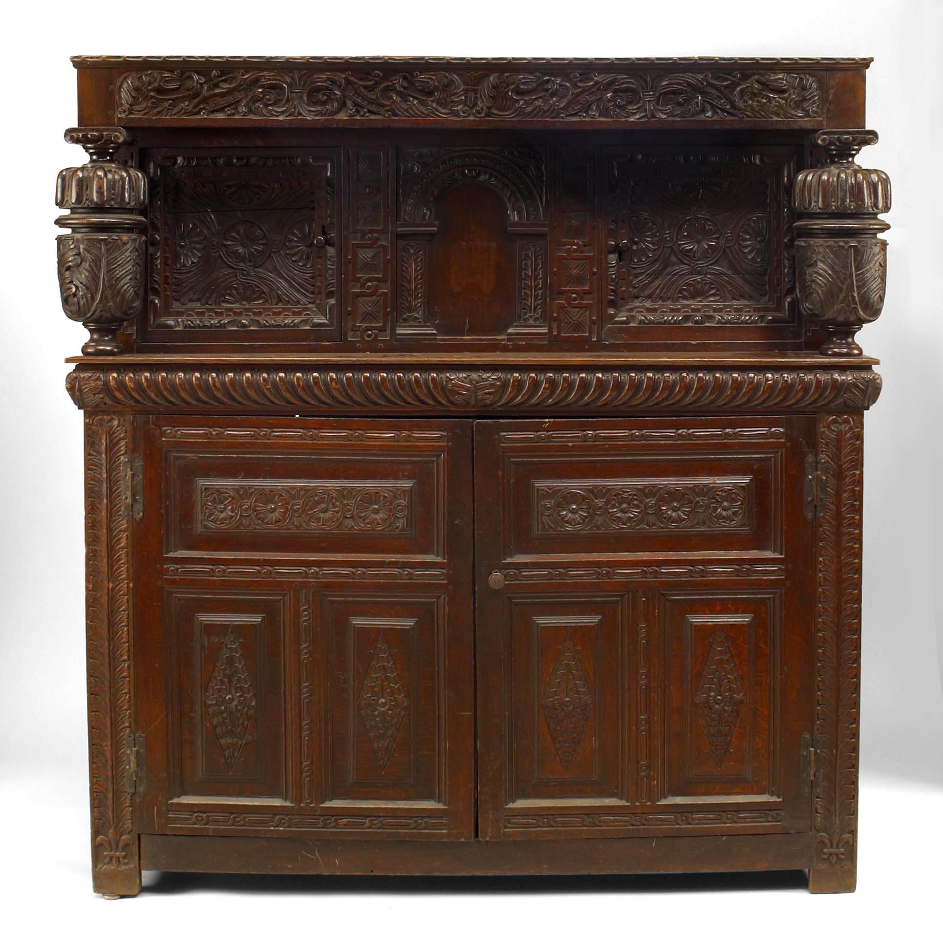 English Charles II-style (17th Century and Later) oak court cupboard of paneled construction with a Pair of doors behind baluster uprights over another Pair of doors

