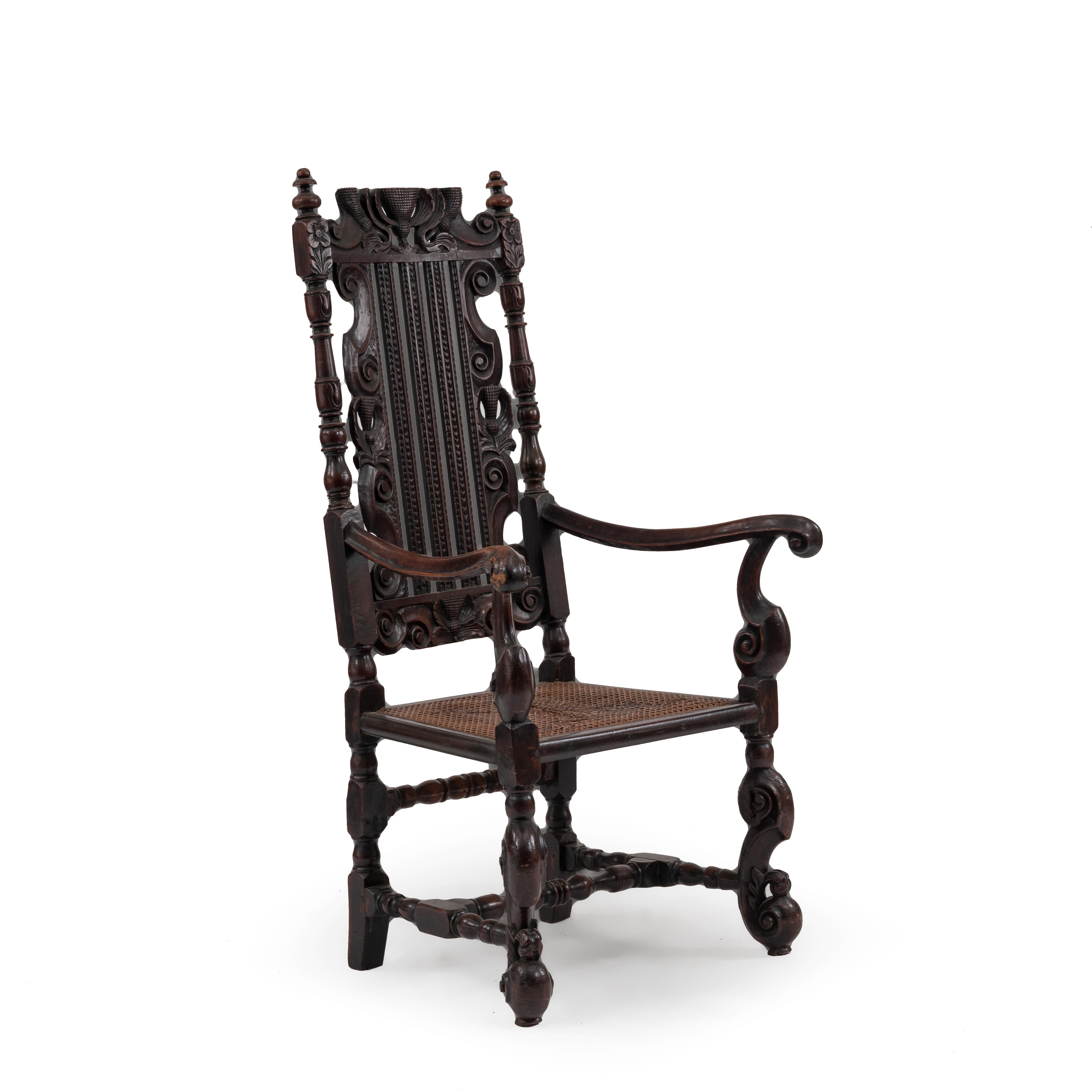 English Charles II style caned & walnut arm chair with vertically slatted back above S scroll legs joined by a stretcher. (19th Cent & possibly with earlier elements).
 