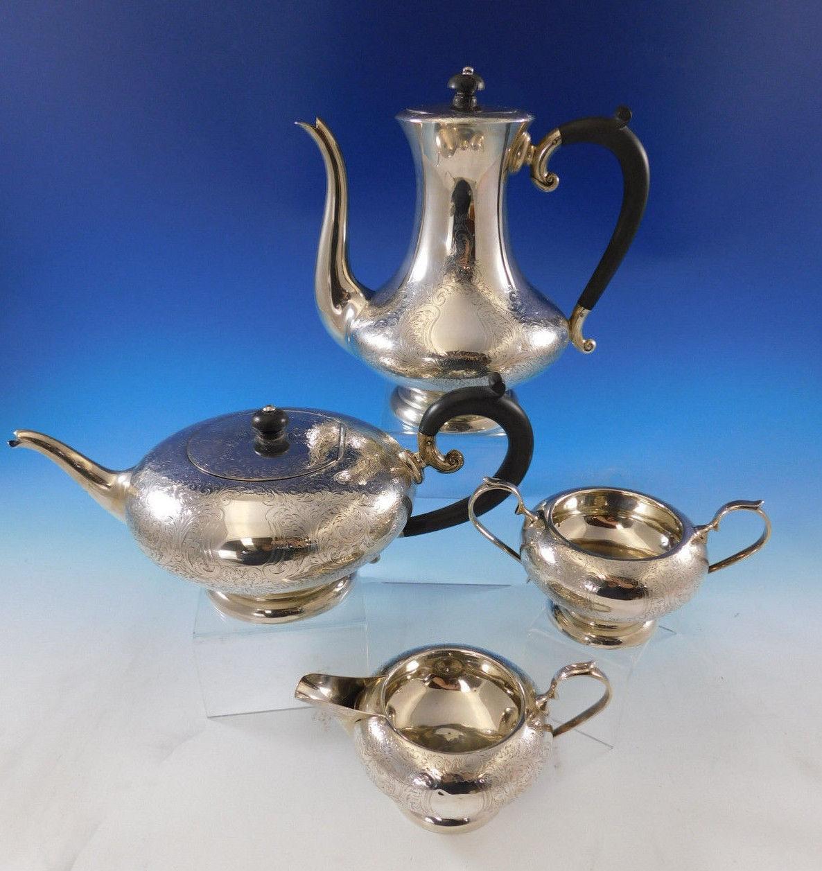 Incredible four-piece sterling silver tea set by Charles S. Green & Co, Birmingham, circa 1940 with beautiful engraved detail presented in a beautiful vintage storage box (box is not original to the tea set, but fits the tea set wonderfully).

This