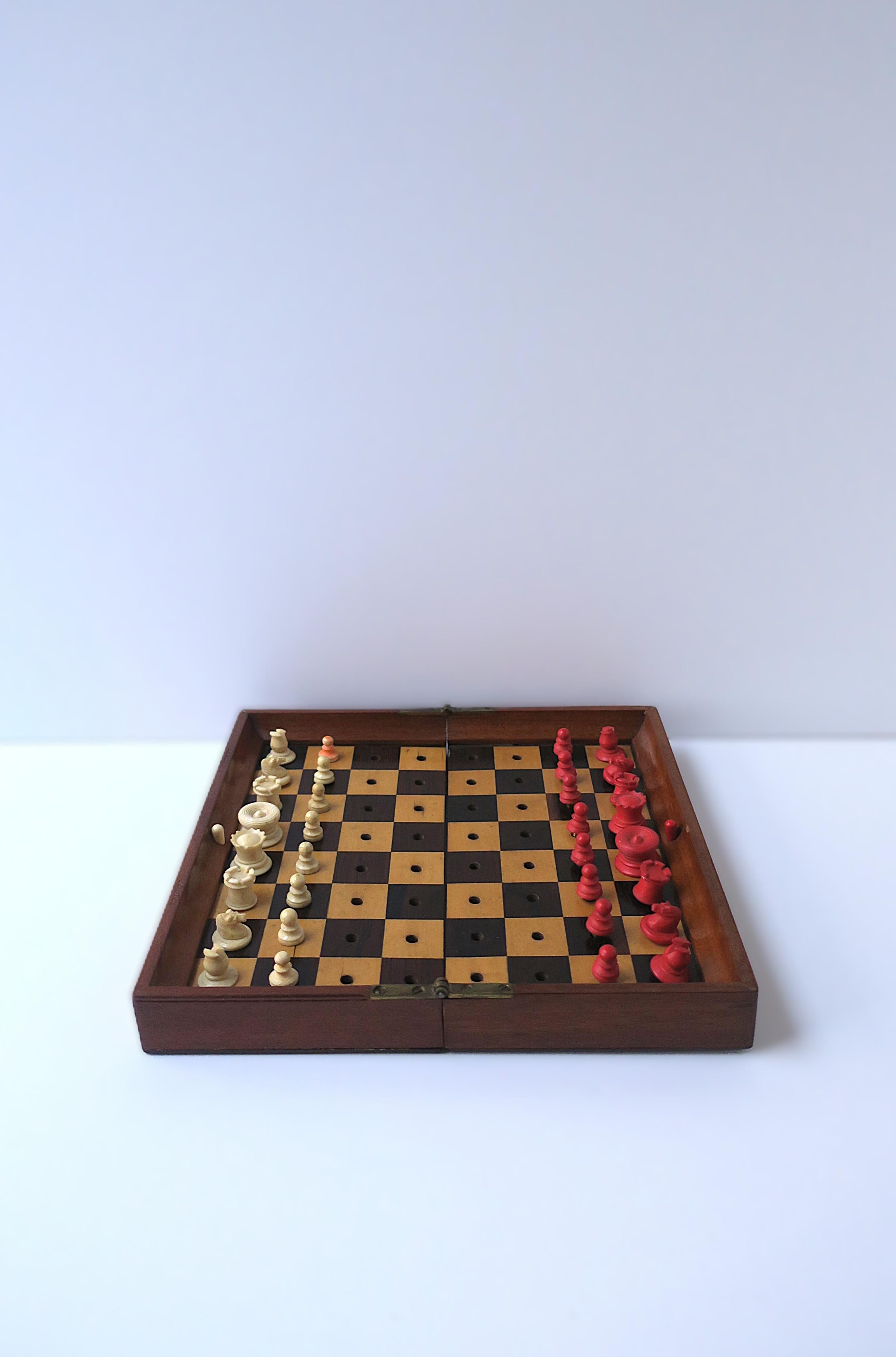 A beautiful antique English portable chess game set, Campaign design, turn-of-the-century, circa late-19th century to early 20th century, London, England. Board, open, measures 9.19