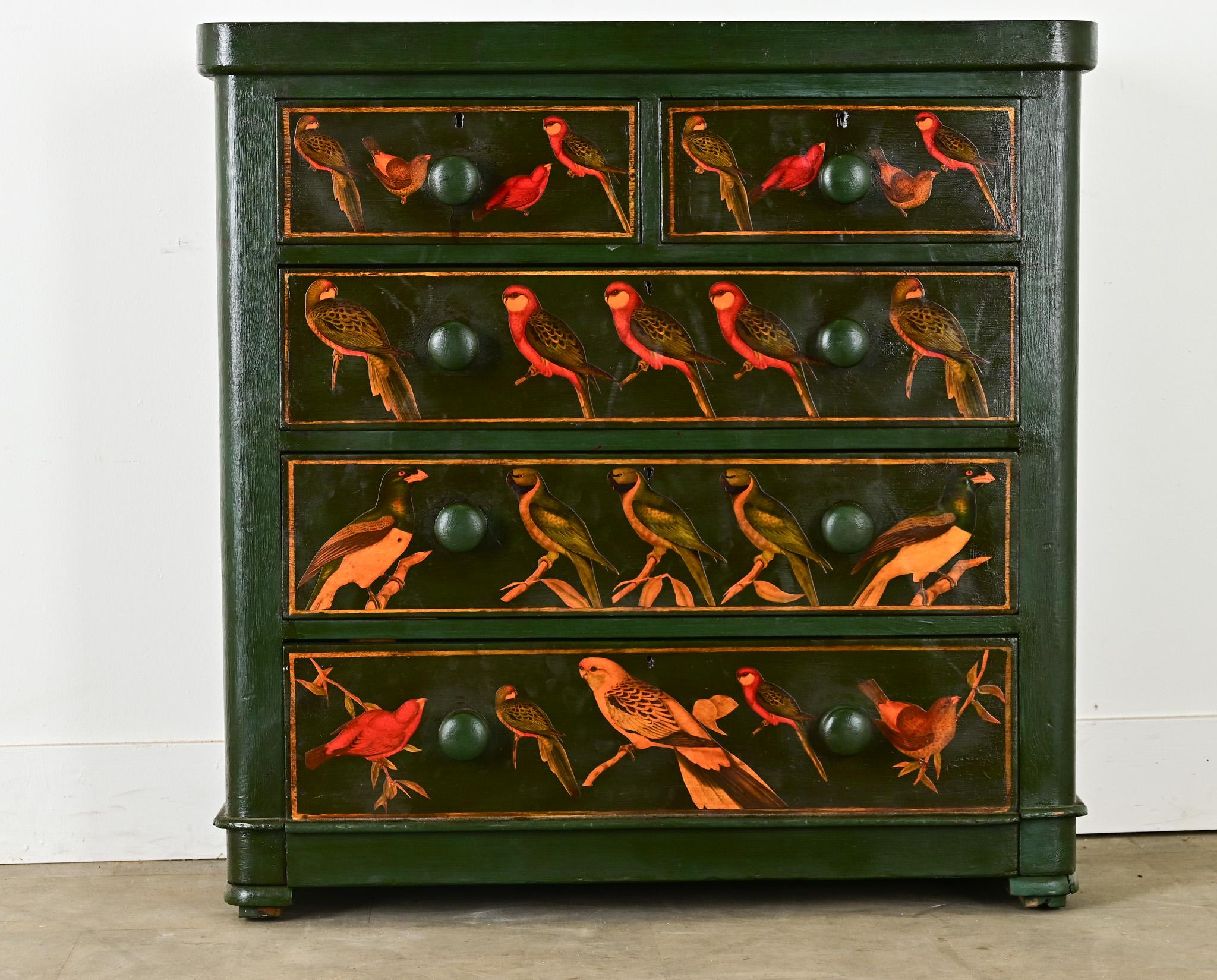 This English 19th century solid pine chest has been recently improved with new paint in a classic shade of emerald green and a decoupaged flock of merry parakeets wrapping the top, sides, and front. Large, turned wood knobs facilitate easy opening