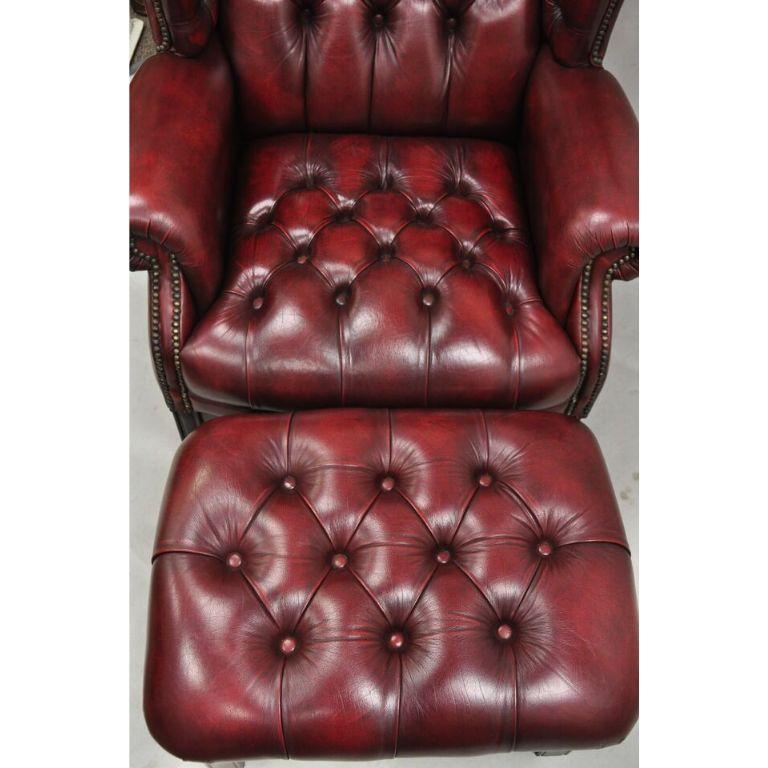 English Chesterfield Oxblood Burgundy Leather Tufted Wingback Chair and Ottoman In Good Condition For Sale In Philadelphia, PA