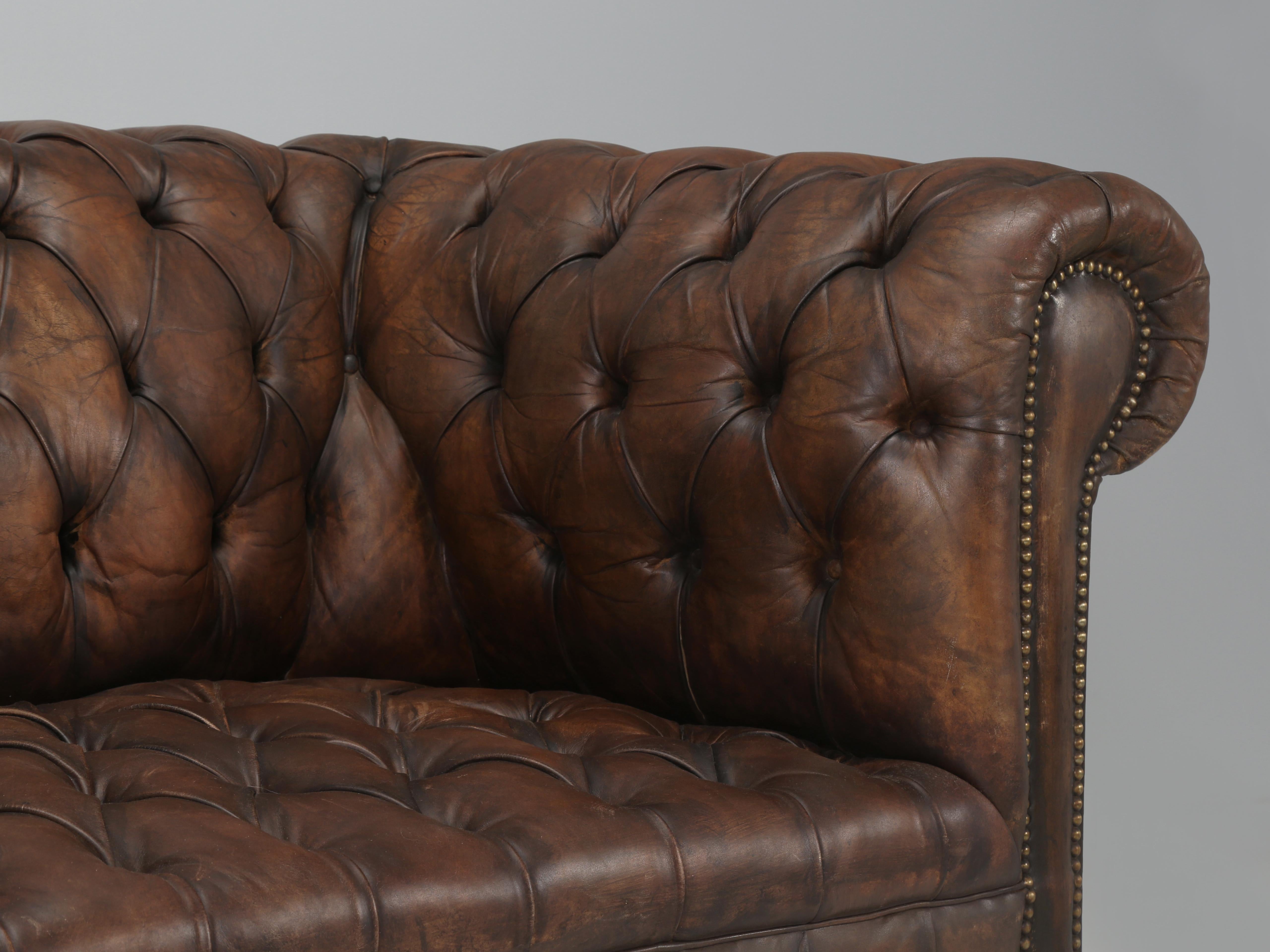 Mid-20th Century English Chesterfield Sofa Restored Internally Maintains Mostly Original Leather