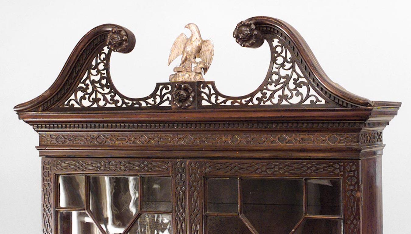 English Chinese Chippendale style (19th century) carved mahogany lattice design secretary with gilt eagle pediment.