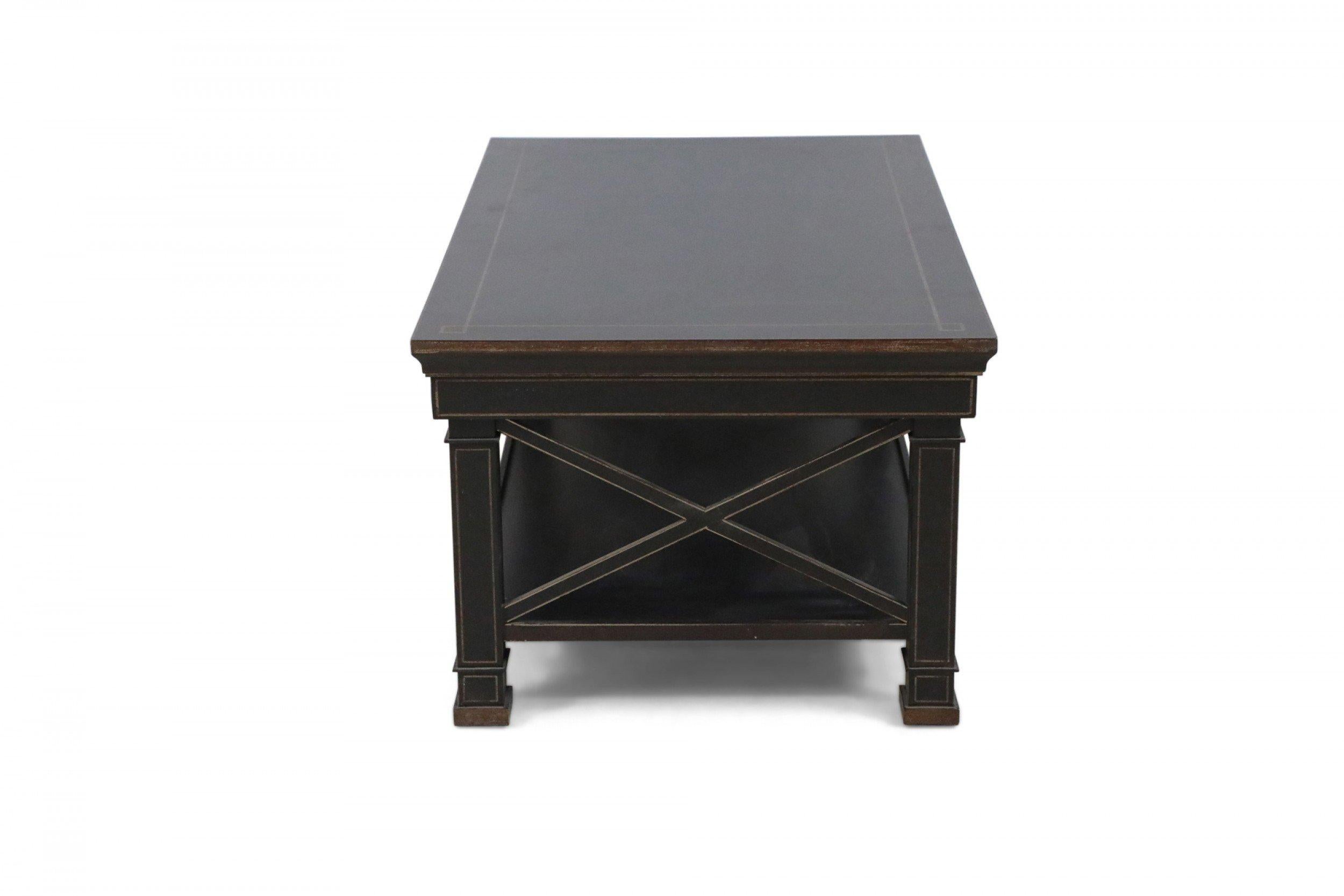 English Chinese-Chippendale-style (modern) wooden coffee table with an espresso finish and rectangular shape traced in a thin, light-brown border, a bottom stretcher shelf, and x-shaped supports on each side.
  