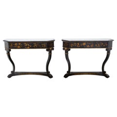 English Chinoiserie Black and Gold Console Tables with White Marble Tops, a Pair