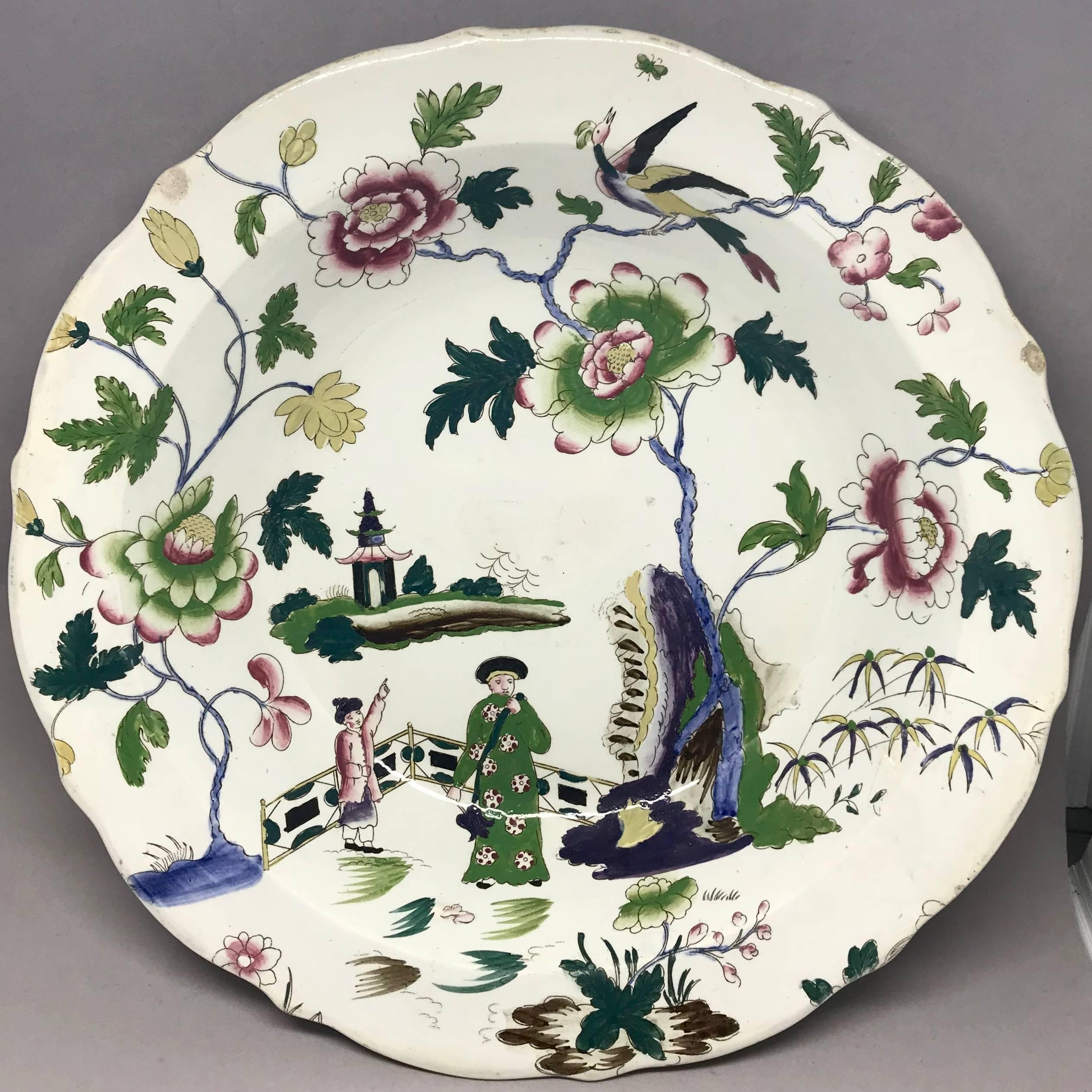 English chinoiserie bowl with flowers birds and figures with pagoda in landscape. Impressed marks for Bestgoods, England, circa 1840s. Dimension: 12