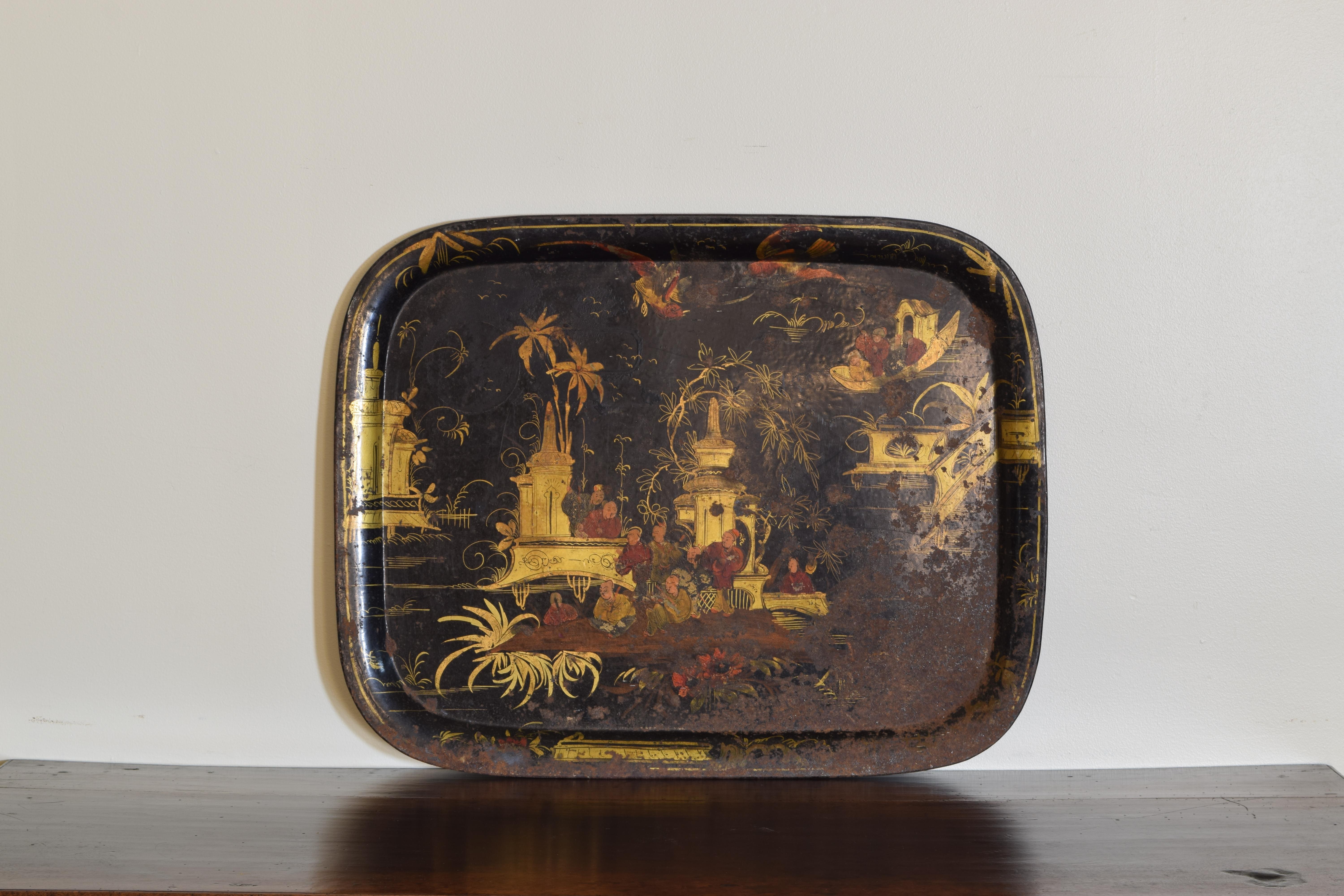 Rectangular with raised outer edge, decorated in faded paint of a chinoiserie theme.