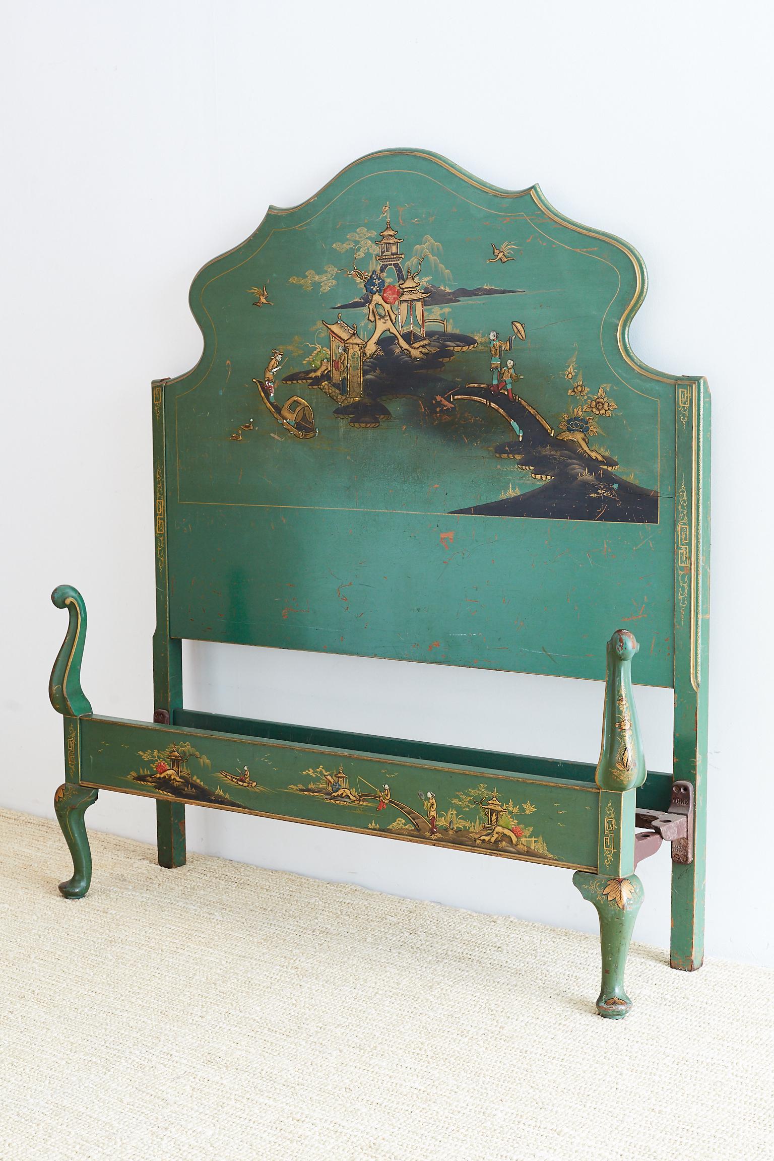 Marvelous English lacquered headboard and matching footboard made in the chinoiserie revival period of the early 20th century. Features idyllic landscape scenes of pagodas and gondolas on a river. The bed frame is decorated with gilt trim in a Greek