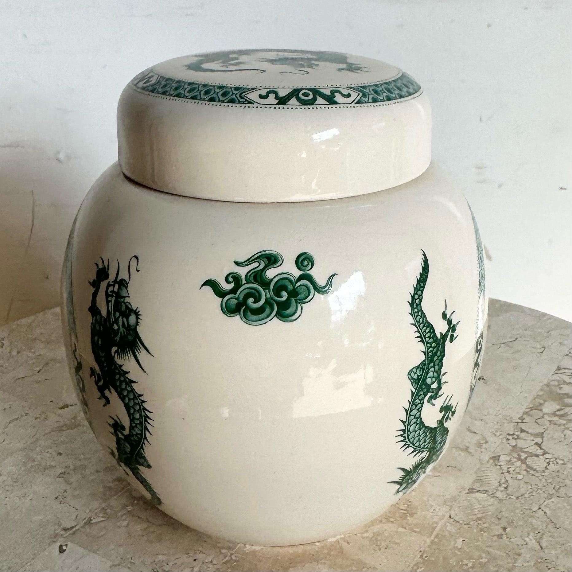 Mid-century English Chinoiserie Green Dragon Ginger Jar by Sadler, featuring a vibrant hand-painted dragon motif on creamy white porcelain.
 
 We sell items as acquired, without restoring or repairing. Vintage pieces may have age-related wear.