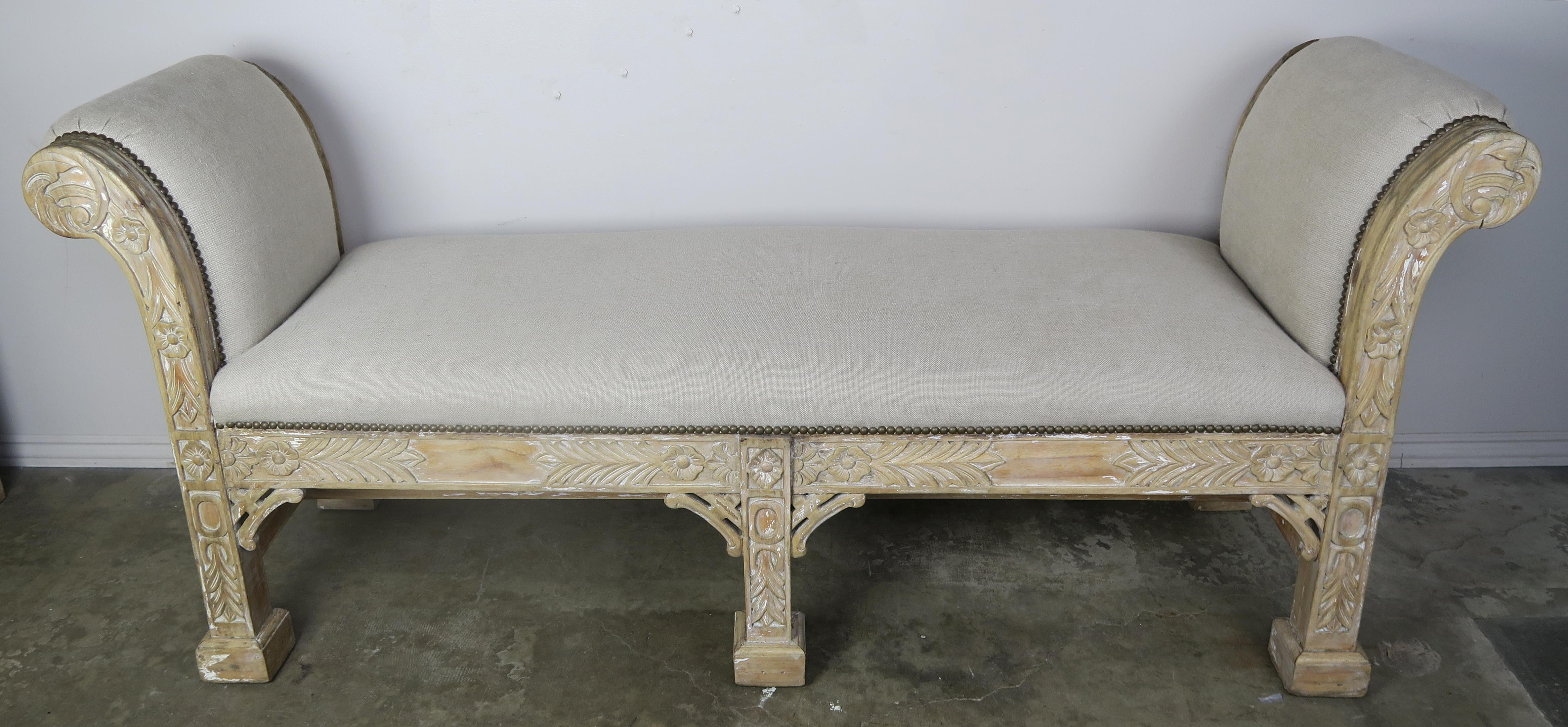 English chinoiserie style six-legged carved natural wood bench newly upholstered in Belgium linen with antique brass nailhead trim detail.
Measures: Seat height 21