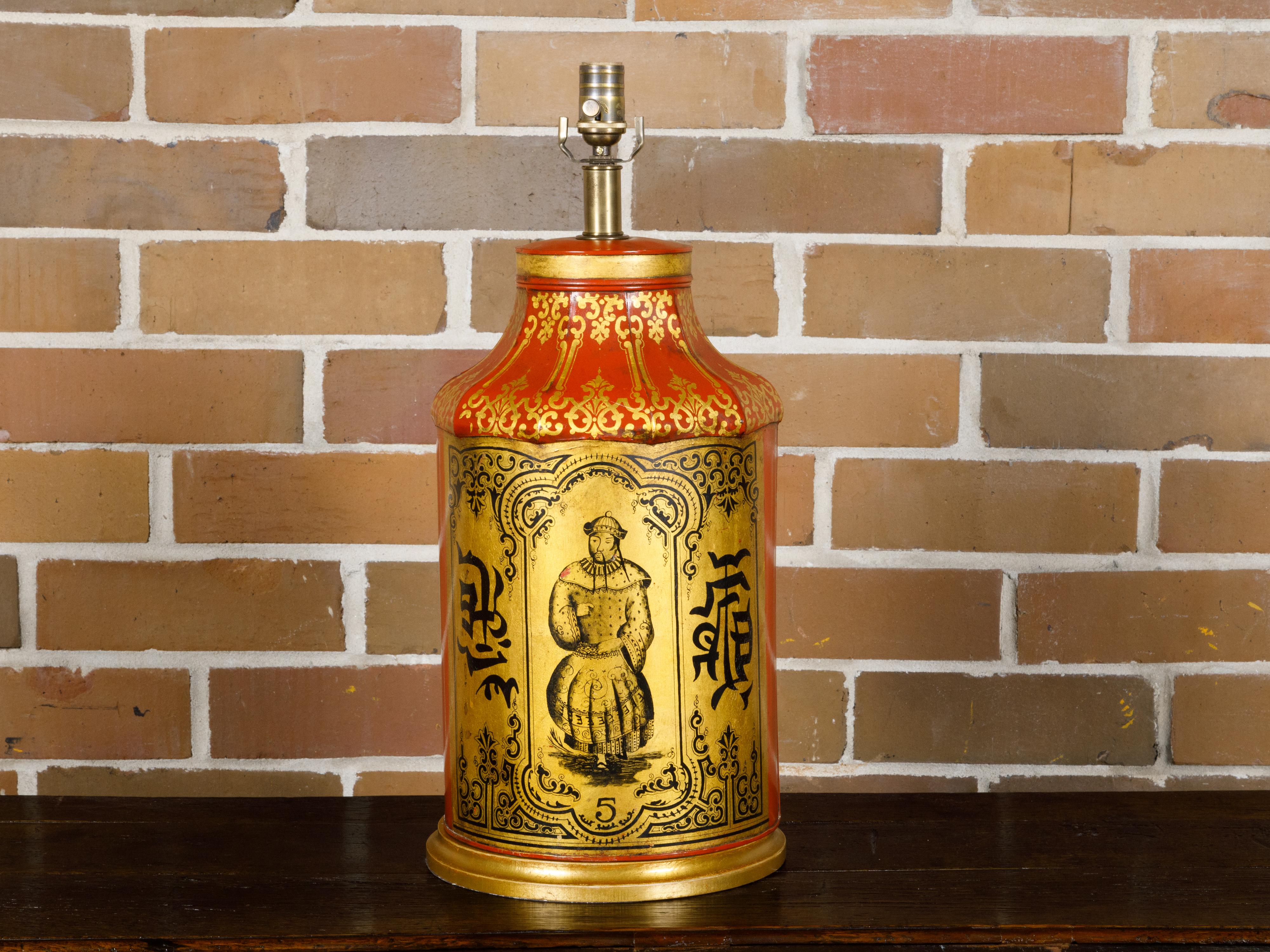An English Chinoiserie tea tin red and gold canister from the 19th century made into a table lamp wired for the USA. This captivating English Chinoiserie tea tin canister from the 19th century, transformed into a table lamp, is a testament to the