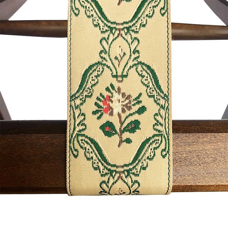 Chintz floral folding stained wood luggage rack. Composed of stained wood, and three chinoiserie chintz floral straps in green, pink and cream. Folds for easy storage. Wonderful to add to a guest room, or for a patio to place a tray while