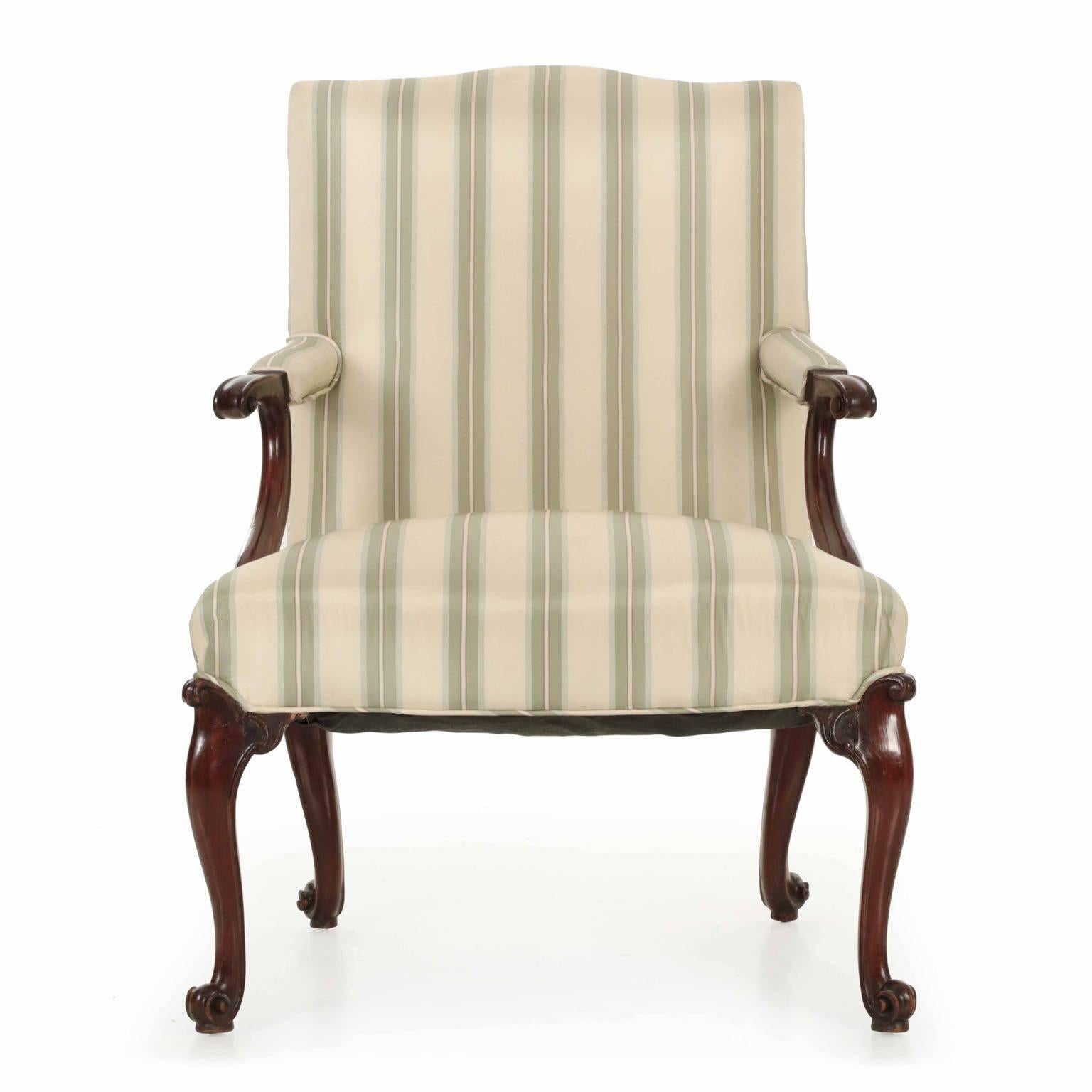 A dramatic and bold armchaircrafted during the last quarter of the 18th century in England, the chair exhibits a forward motion that is powerful and most striking. The essence of the rocaille is captured in the scrolling knee returns and the intense