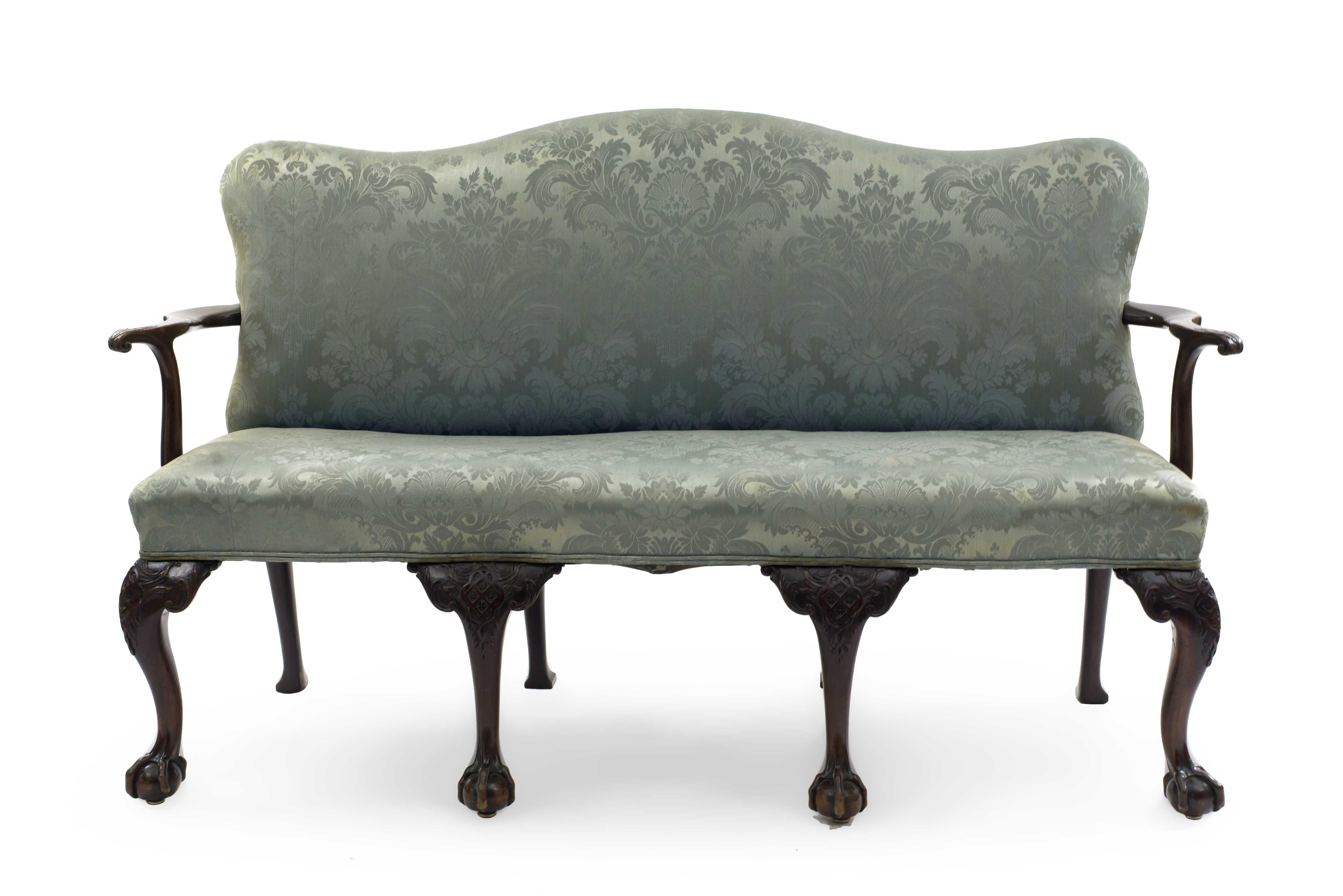 English Chippendale style (19th century) mahogany camel back settee with 4 carved front legs and blue damask upholstery.