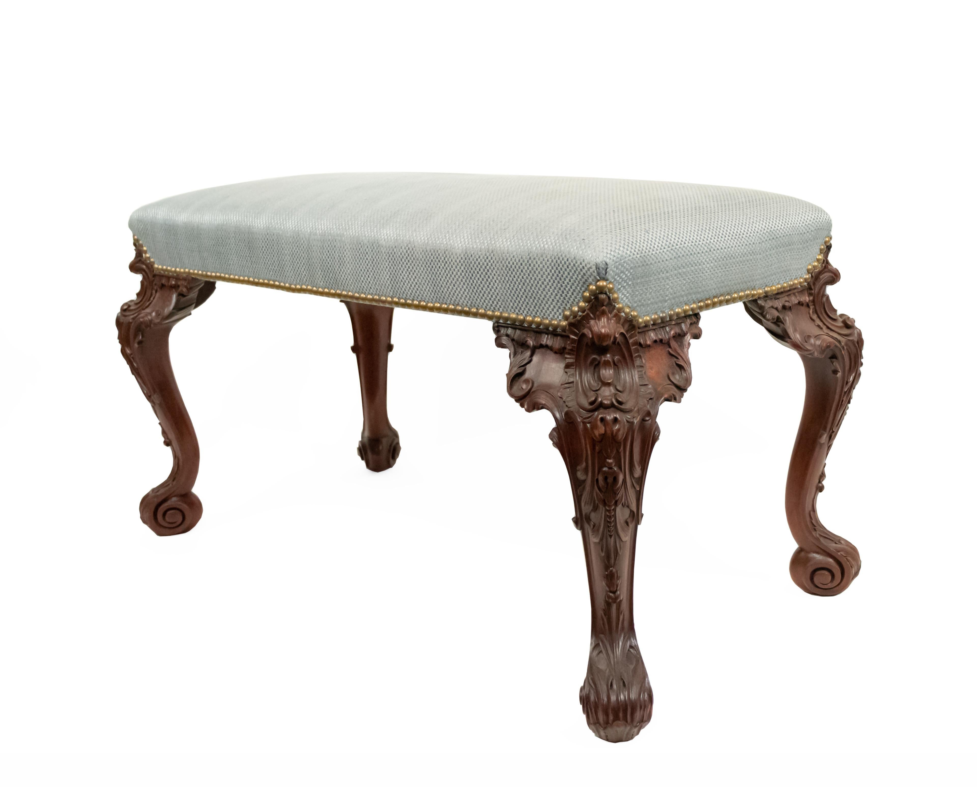 19th century English Chippendale style rectangular carved mahogany bench with blue upholstery.