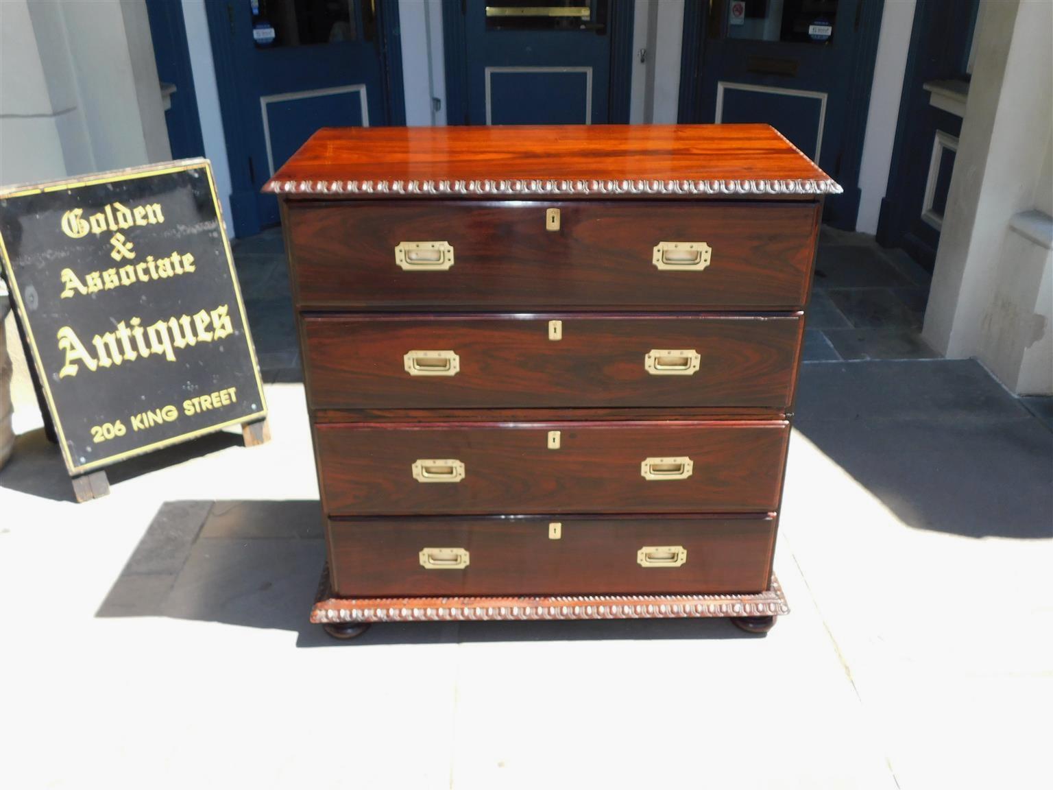English Chippendale Kingwood Military Campaign graduated chest with an upper drawer fitted with a hinged fall front secretary revealing a central prospect door with a secret interior drawer, flanking pigeon holes with eight interior drawers, top