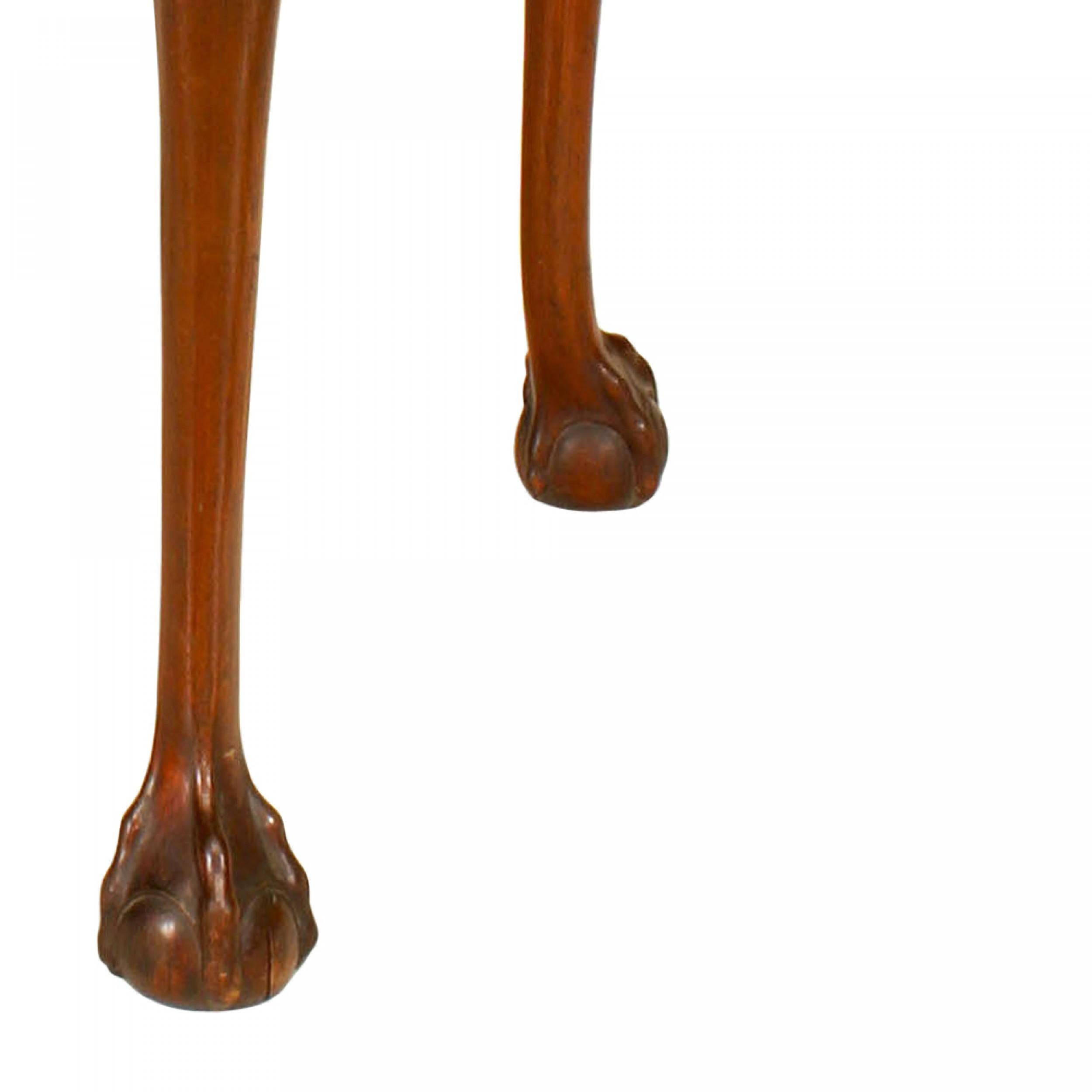 English Chippendale style (19/20th Century) oval mahogany center/tea table with ball and claw feet and carved apron.