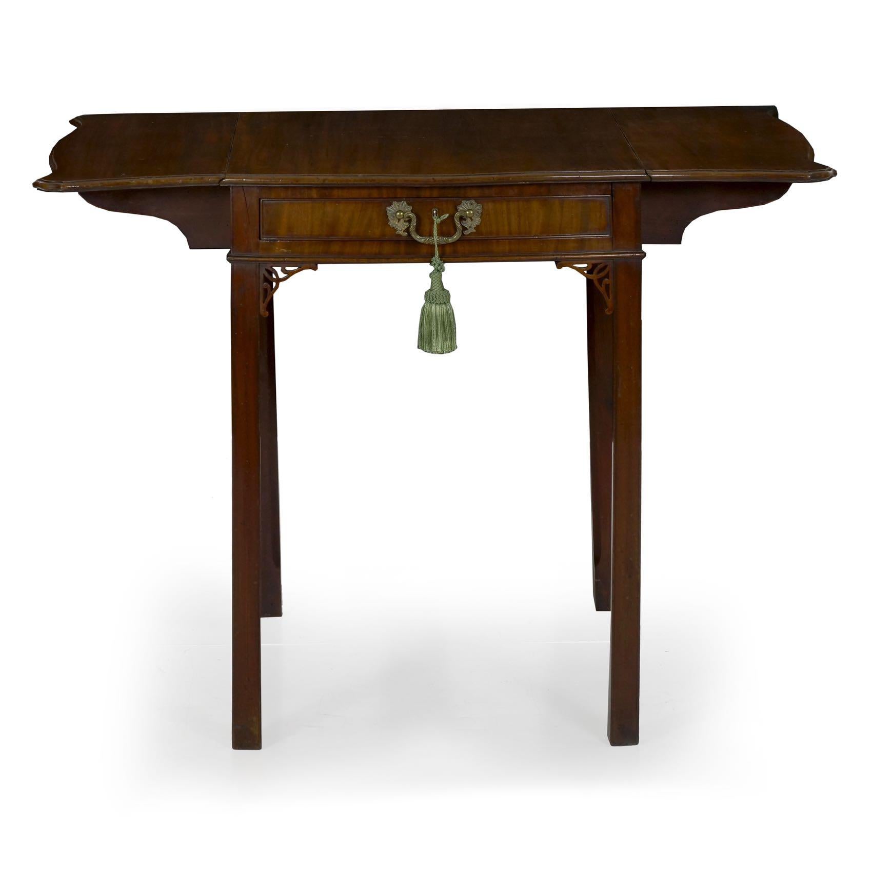 A very fine Chippendale period Pembroke table preserved in beautiful original condition, this exquisite gem is crafted of a dense Cuban mahogany in the primary surfaces throughout. This wood takes on a gorgeous polish and the patina has built up to