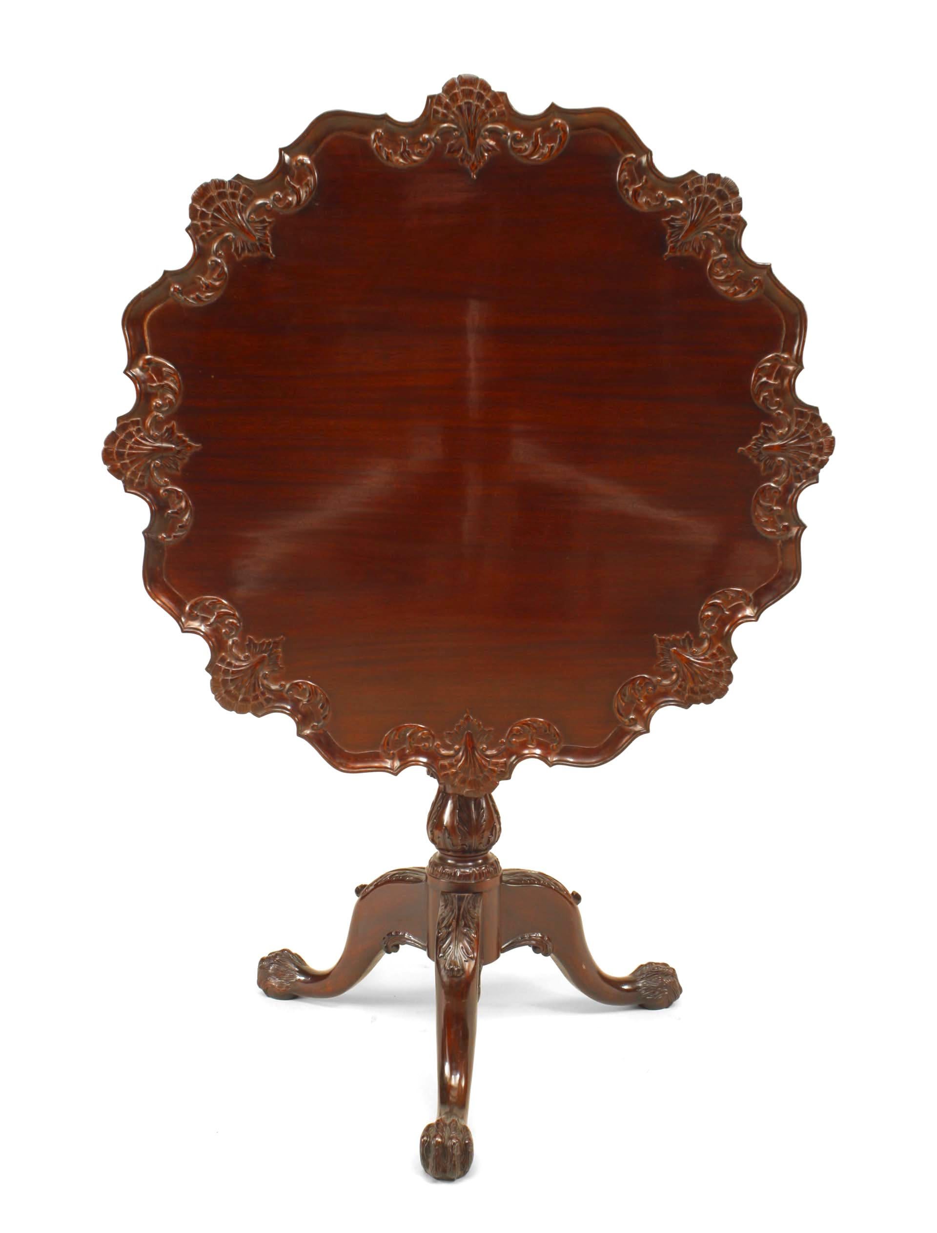 20th century English Chippendale style mahogany tilt-top end table with shell design carving to top edge.