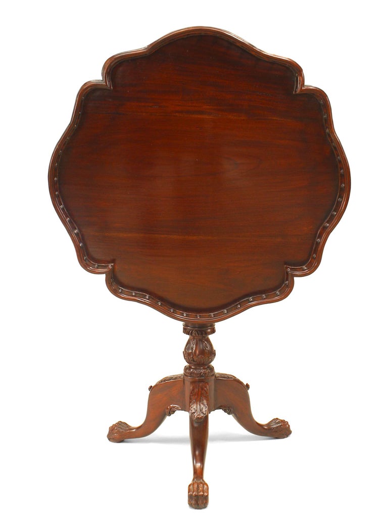 20th century English Chippendale style mahogany pedestal base end table with spindle gallery tilt-top.