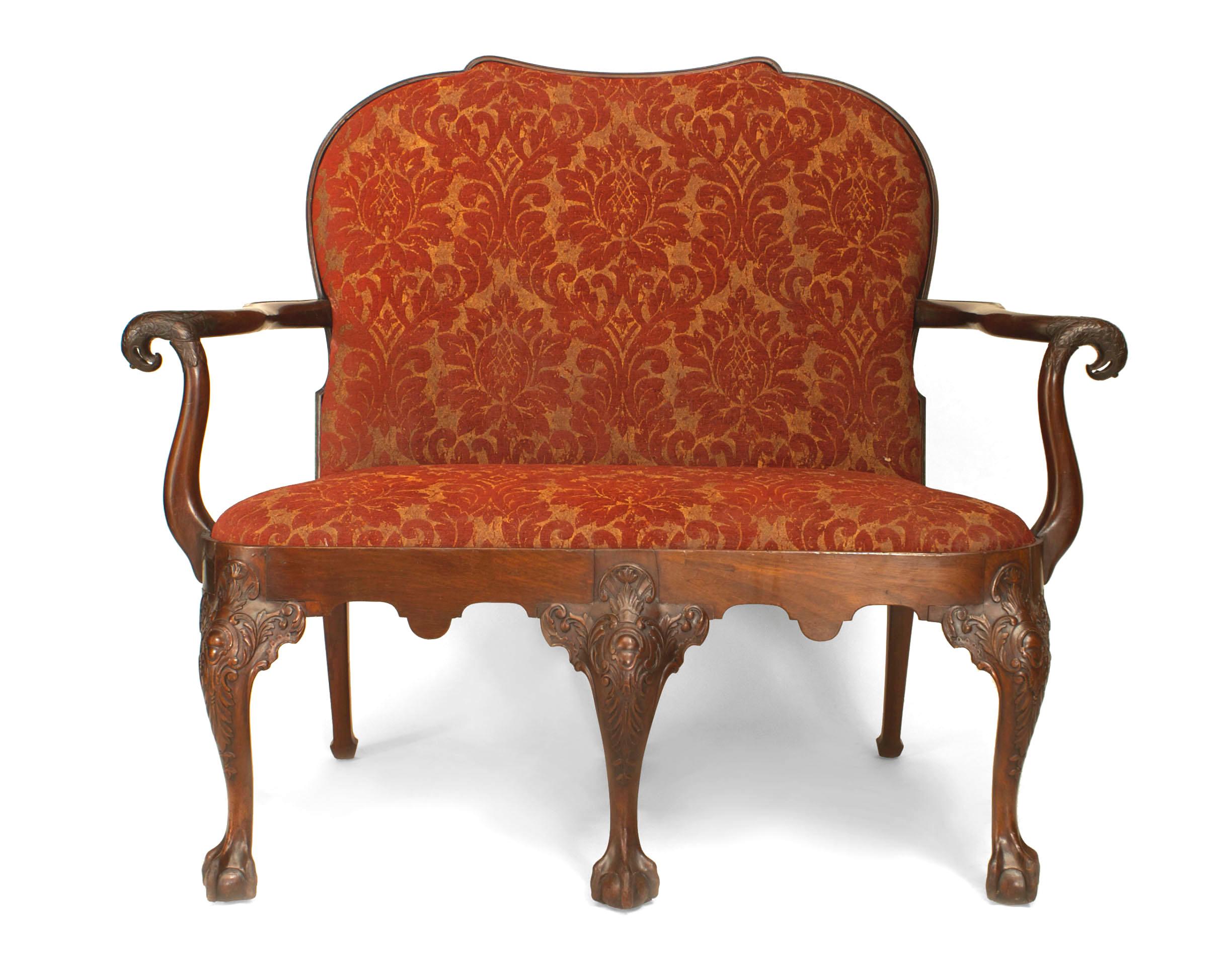 English Chippendale style (18th-19th century) mahogany loveseat with eagle head arms and upholstered seat and back.
 