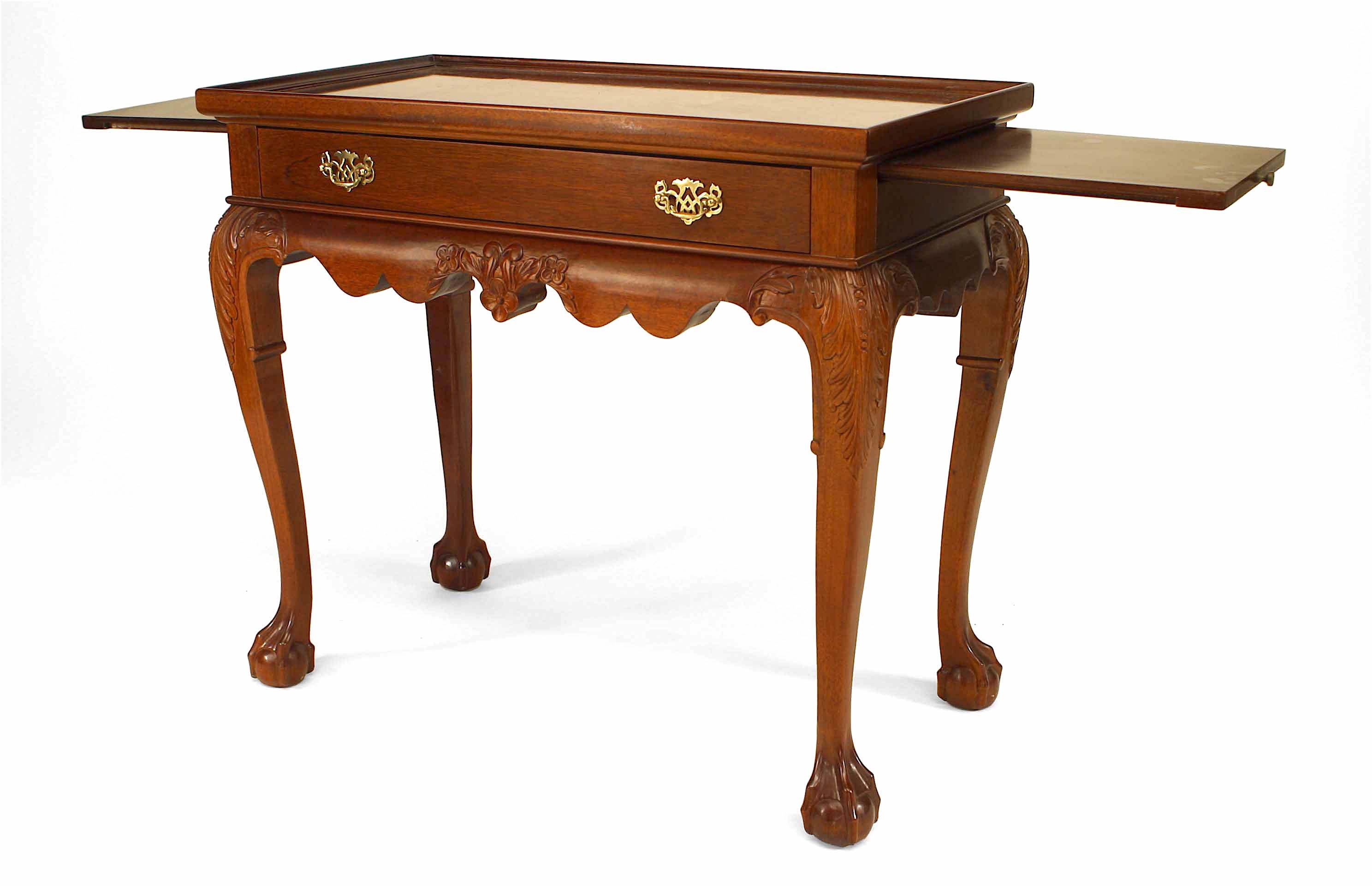 English Chippendale style (20th century) mahogany rectangular console table with drawers, side slide shelves, and raised edge.
 