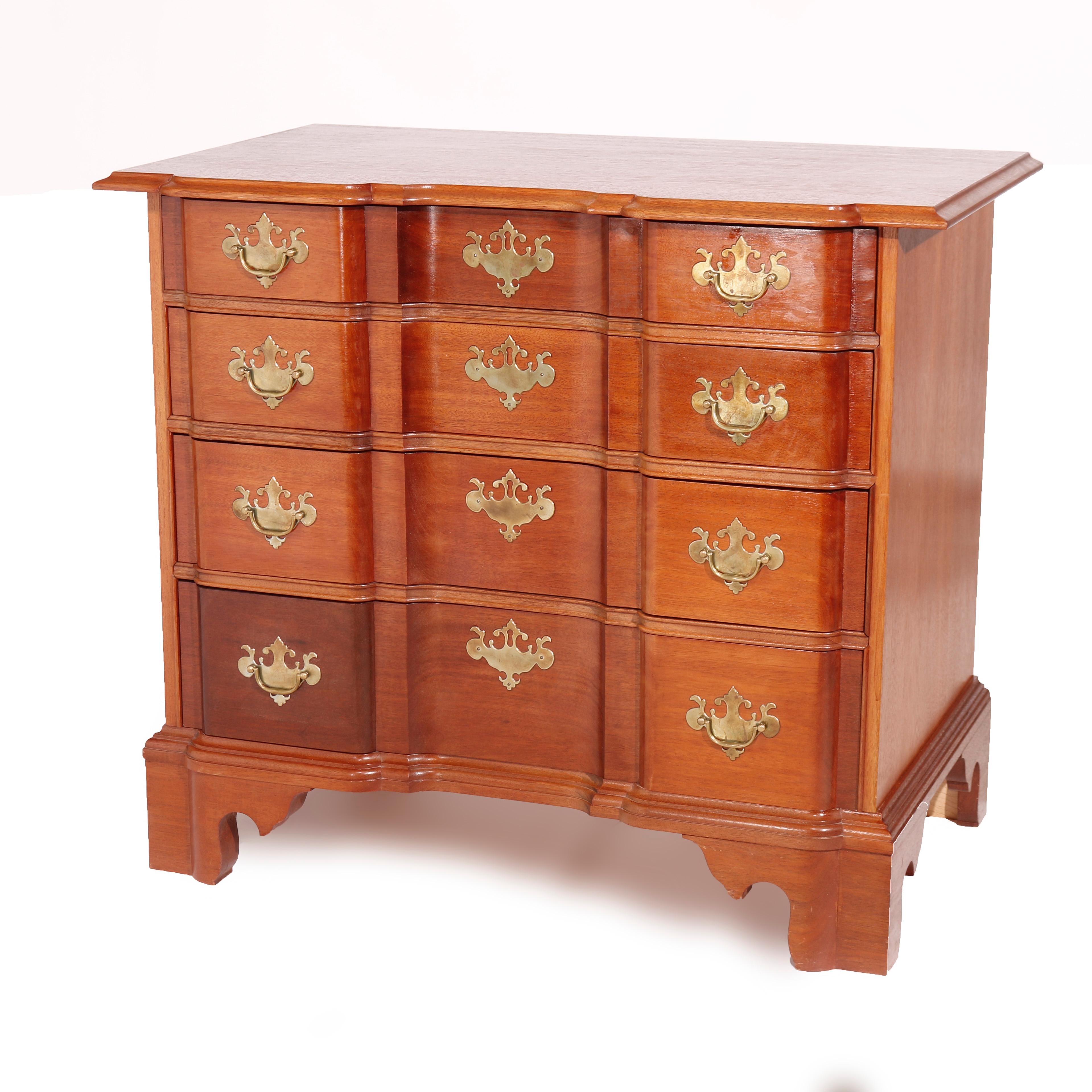 An English Chippendale style chest of drawers attributed to the Williamsburg Bartley Collection offers shaped top over graduated long drawers and raised on bracket feet, maker mark as photographed, 20th century

Measures - 31
