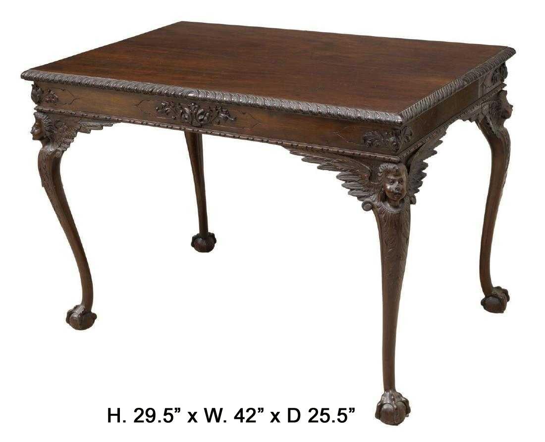 Beautiful English Chippendale style finely carved mahogany side table, mid 20th century. 
The rectangular top with gadrooned edges is over a mahogany frieze carved in a foliate motif, raised on four finely carved winged monopodiae legs terminating