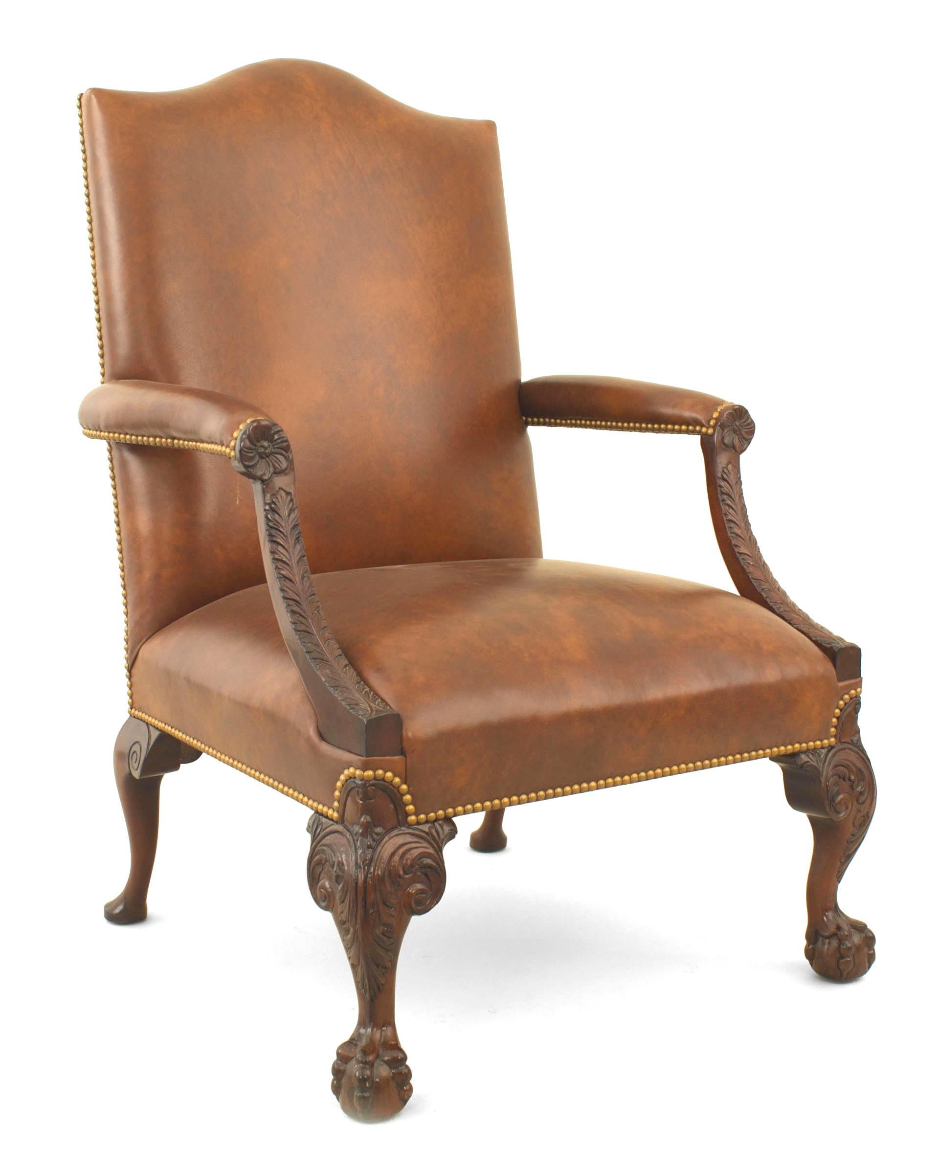English Chippendale style (modern) mahogany carved open armchair with a shaped back and upholstered in brown leather.
 