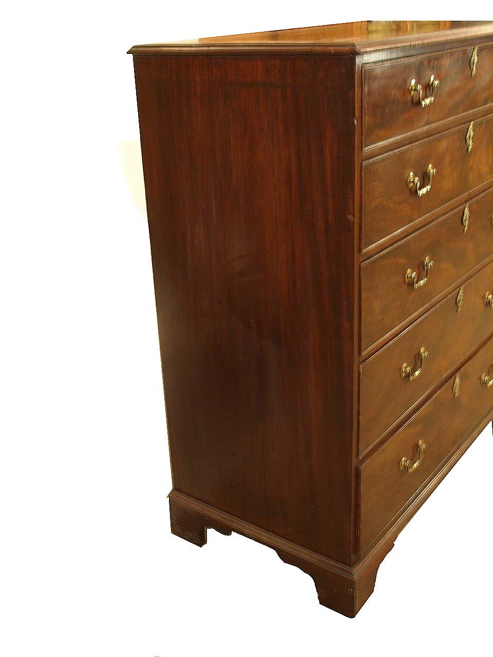 English Chippendale two over four chest , the top is veneered in two pieces with mahogany over pine secondary wood, the graduated drawers are veneered with flame mahogany over mahogany secondary wood with oak being the secondary bottoms and drawer