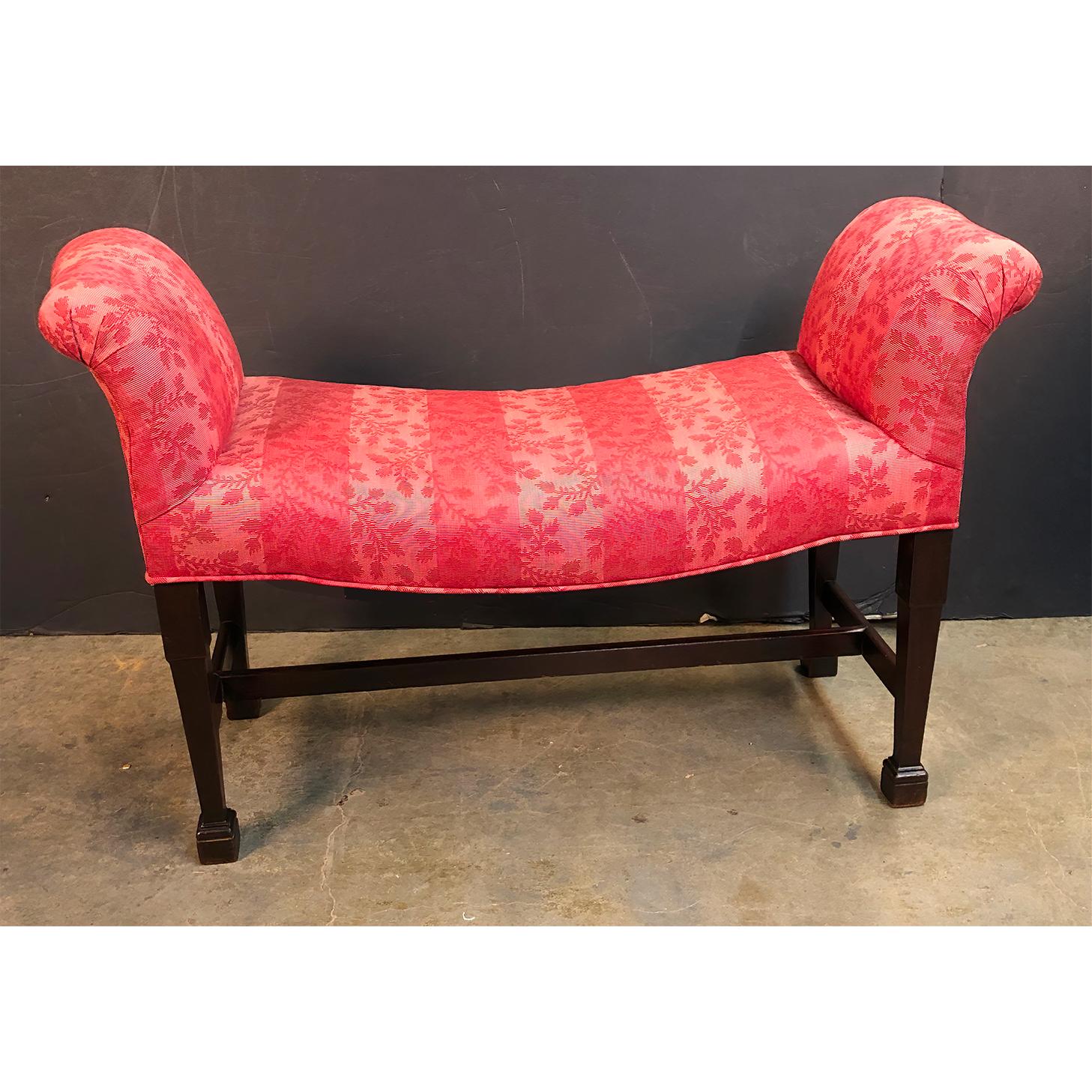 A fine and rare English George III mahogany (Chippendale) scroll arm window bench with an upholstered seat and arms, saddle seat with an H stretcher base and with bold Marlboro feet.
