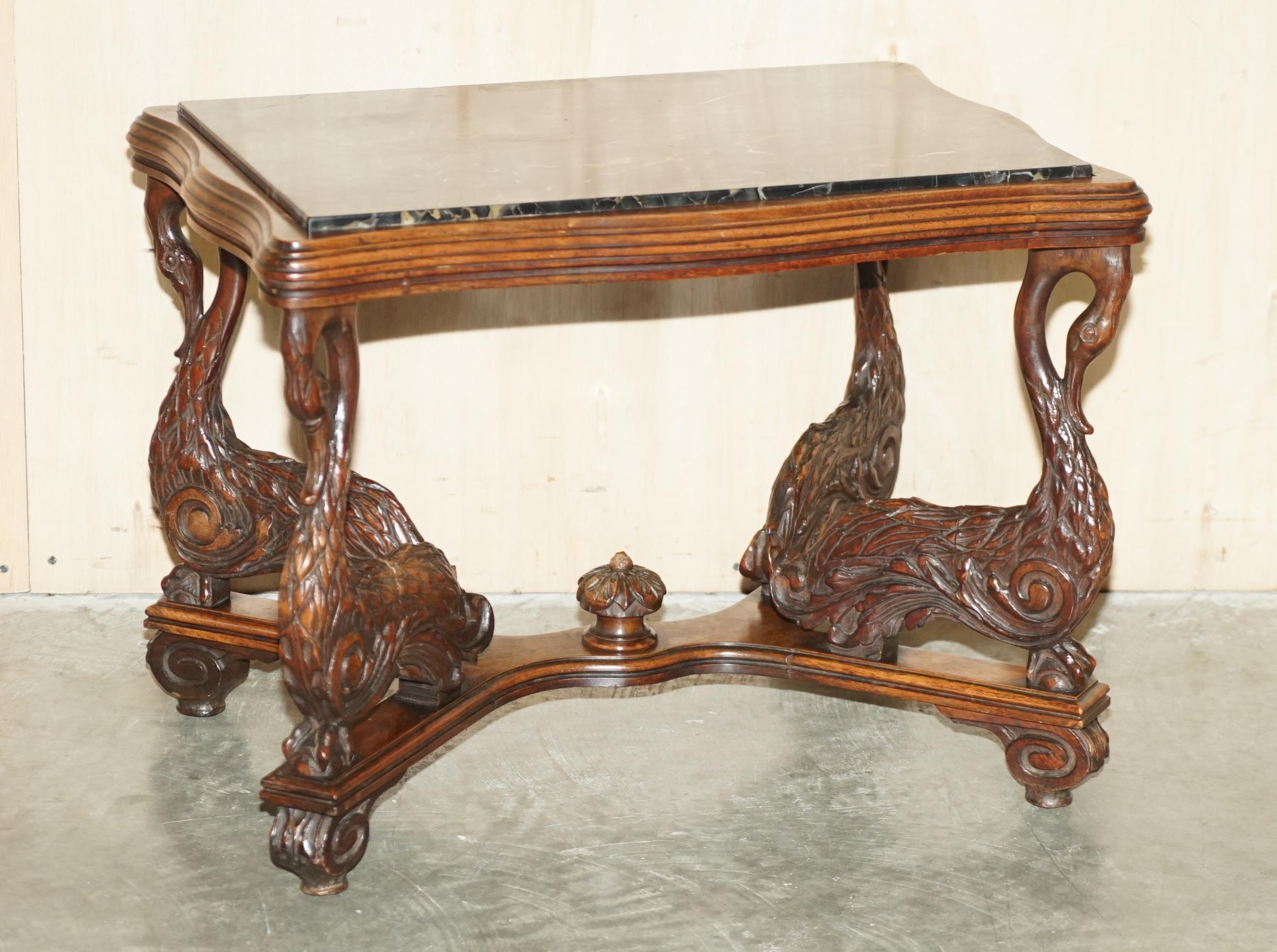 We are delighted to offer for sale this rare and highly collectable circa 1880 hand carved depicting Swans solid oak with marble top side or occasional table.

A very decorative and well made piece. I’ve not seen this type of carving before on a