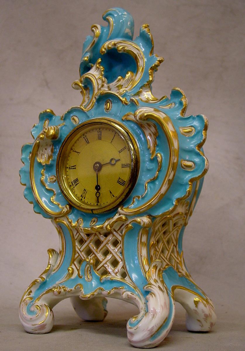 Fine and rare English Coalbrookdale porcelain clock in excellent condition. 8 day English fusee movement signed and numbered by the renowned maker Vulliamy.