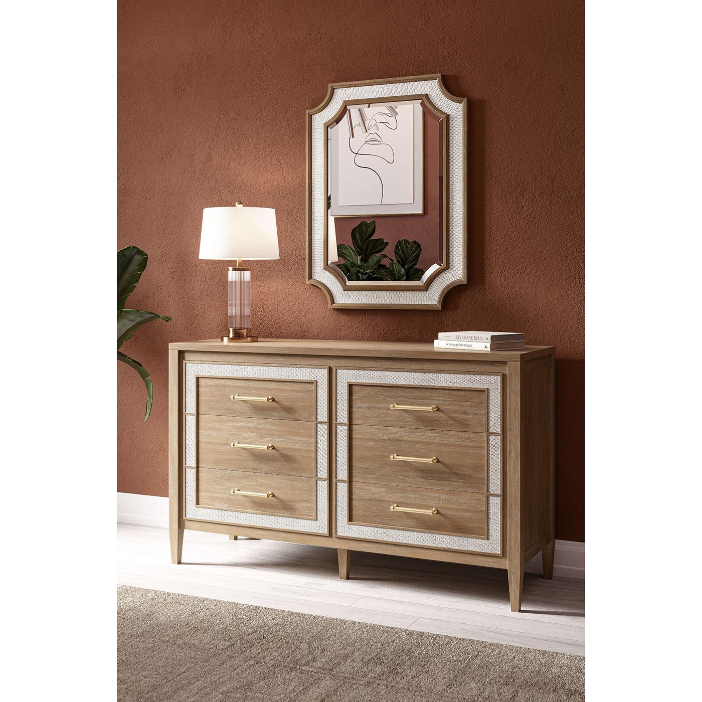 Featuring a Neo Classic form mahogany frame in a natural Sandbar finish, this exquisite piece exudes charm and sophistication. The chic gold handles and Rattan White details enhance its luxurious appeal, making it a standout addition to any home