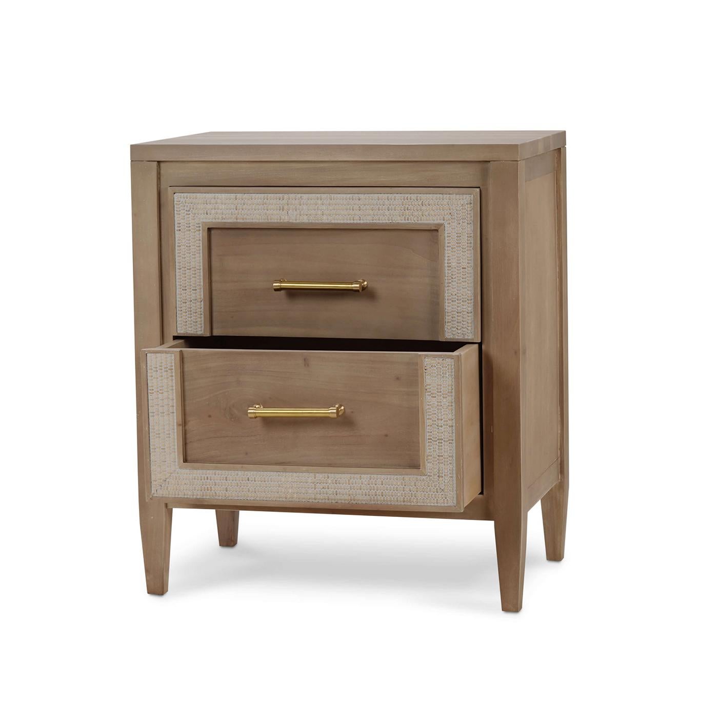 Featuring a Neo Classic form mahogany frame in a natural Sandbar finish, this exquisite piece exudes charm and sophistication. The chic gold handles and Rattan White details enhance its luxurious appeal, making it a standout addition to any home