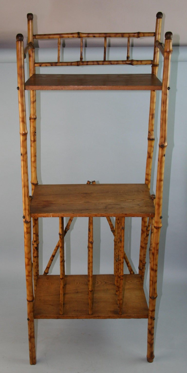 1391 oak and bamboo two tier free standing shelf unit with record record slots on bottom shelf.