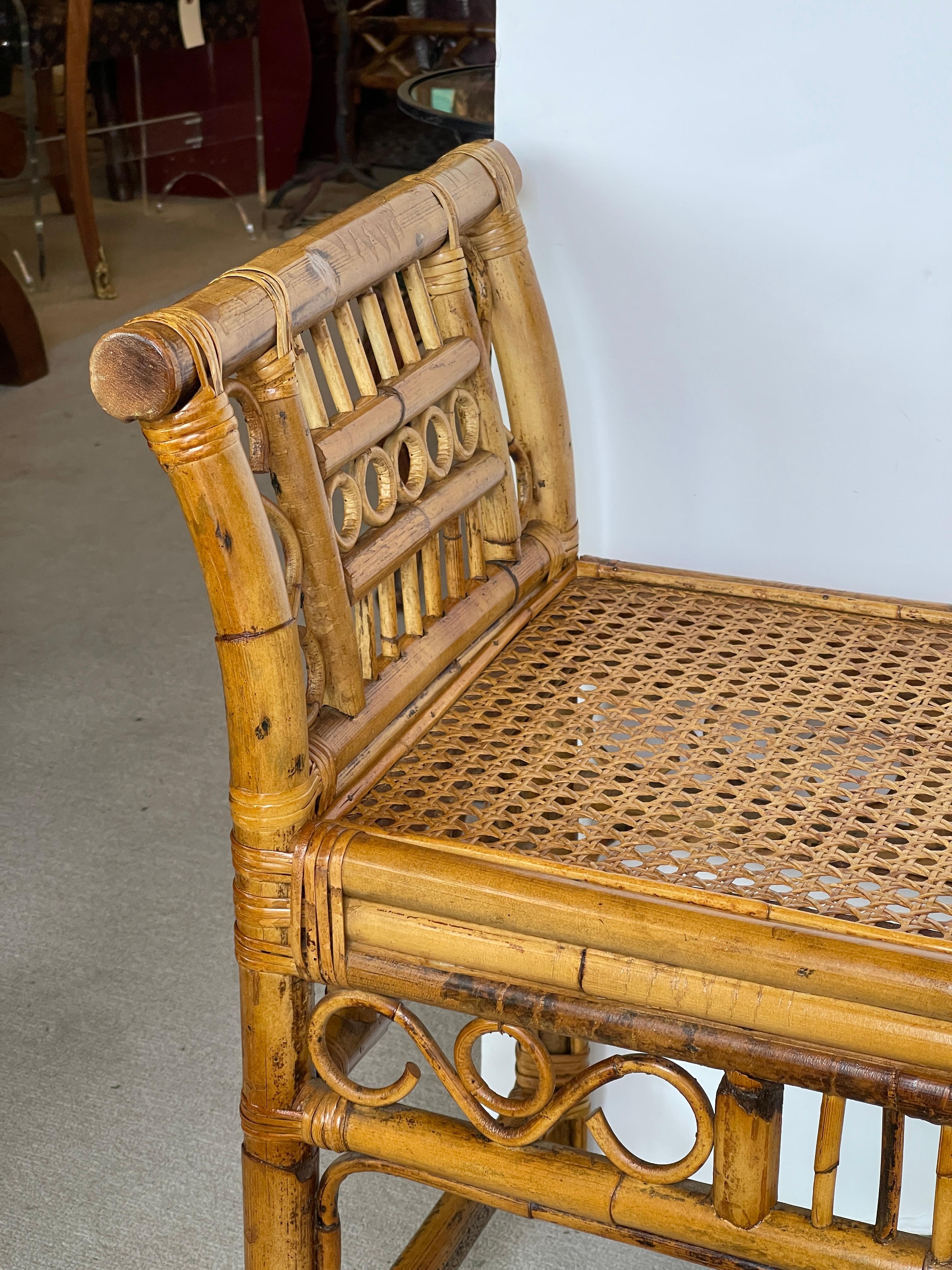 Just is this very good looking Large English colonial Brighton Style Bamboo and Cane Bench, with a beautiful fretwork design through out.
This bench is in wonderful antique condition, the cane in intact.
The color is a Honey mottle color..
Very good