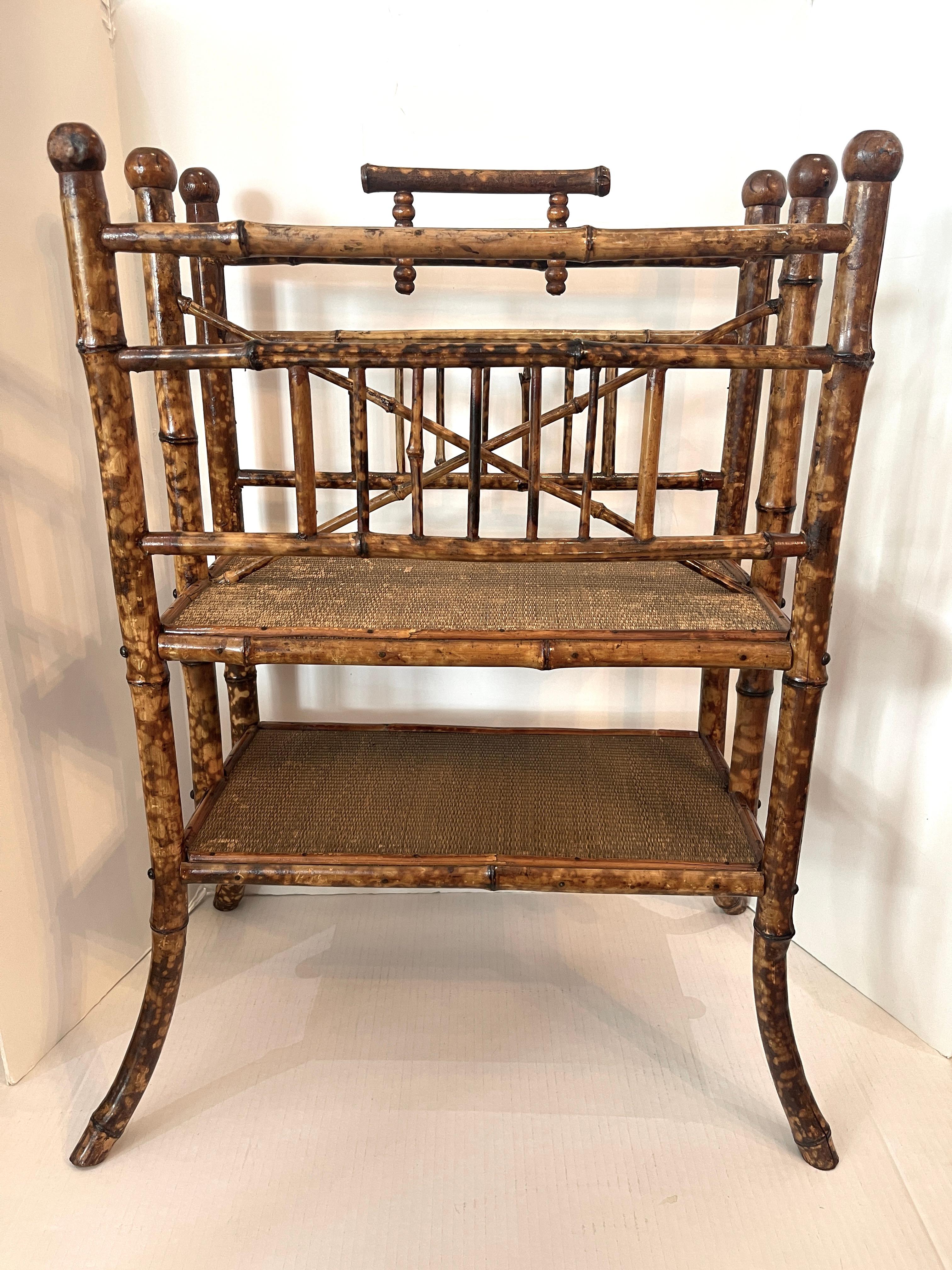 Just in, this English Colonial Tortoise Shell Large Magazine Holder,.
This piece is from the period and has a beautiful Tortoiseshell color to the bamboo frame.
It has two tiers of shelves with the original Grasscloth, I did not want to change them