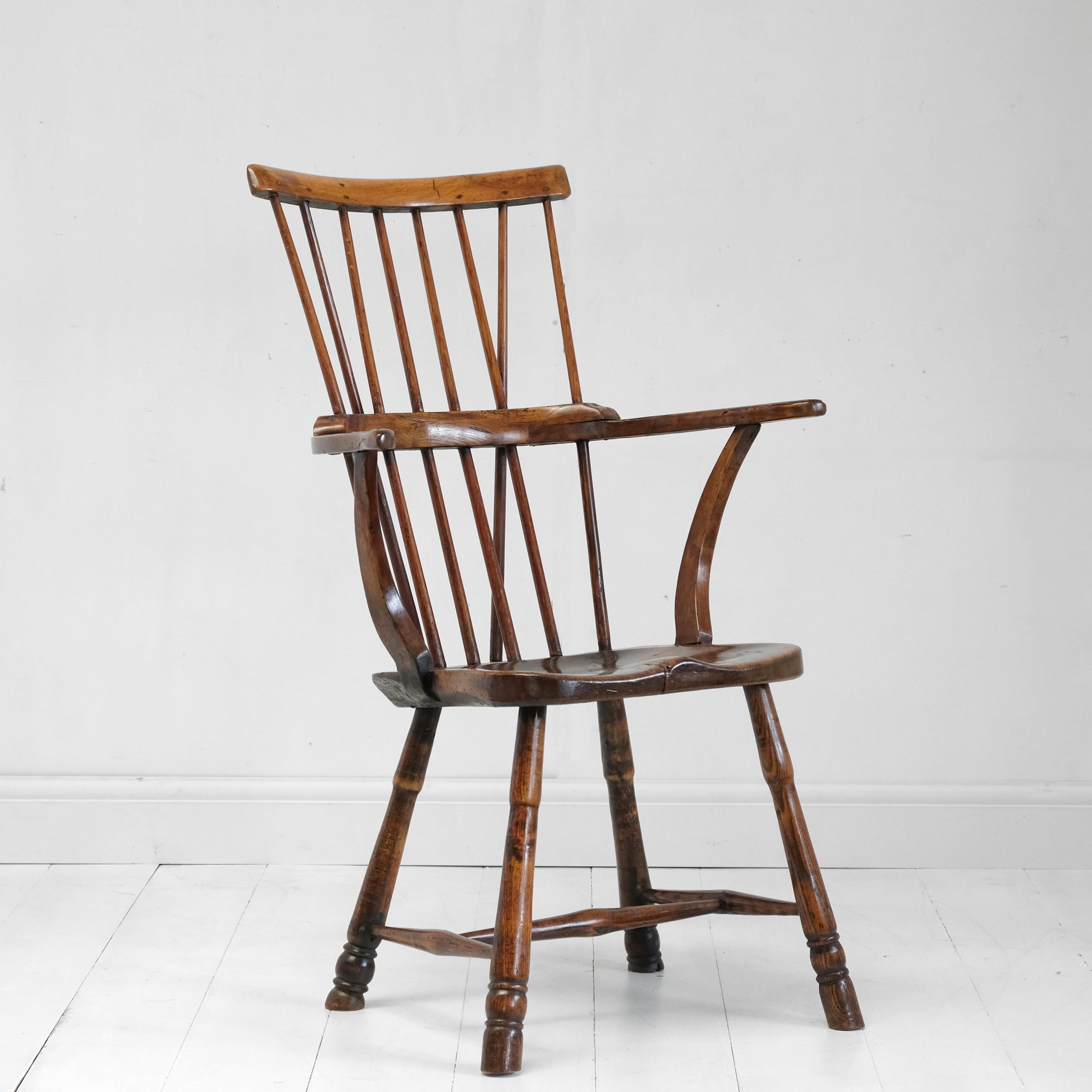 A good comb back Windsor chair. In the style of the famous Oliver Goldsmith chair but with obvious regional variations - this leads me to believe this is a West Country example. Egg and reel turned legs, united by a tapered H stretcher, shaped