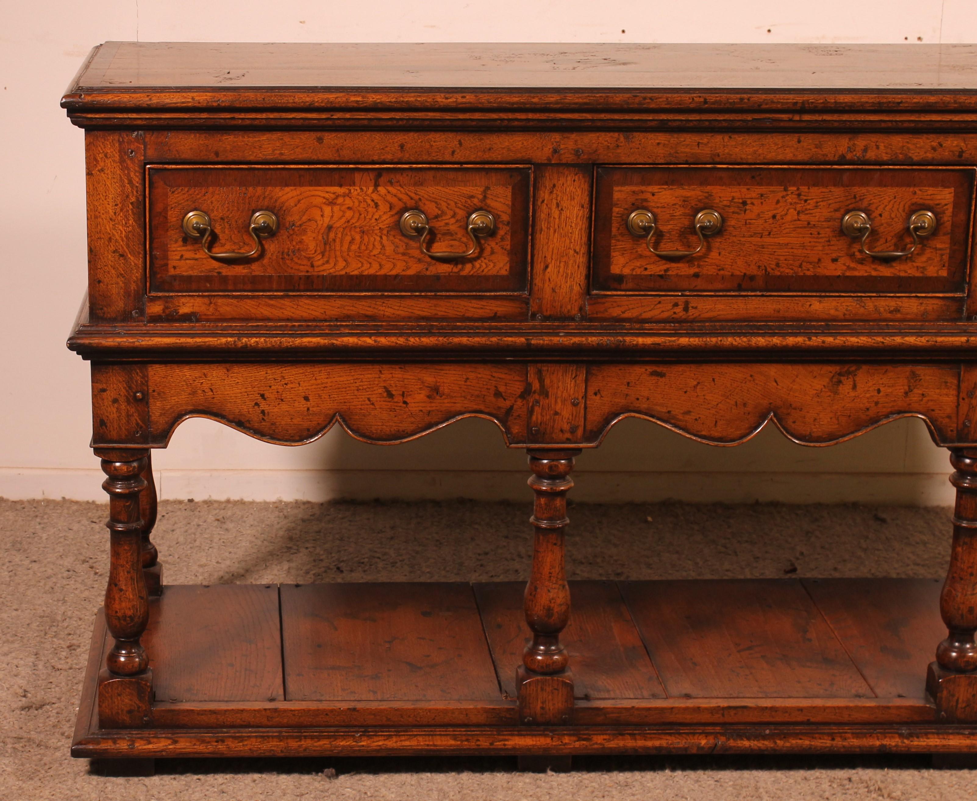 Superb English console called dresser base from the second half of the 19th century

Elegant console which has three drawers in the belt. Each drawer is decorated with mahogany inlay. What is unusual and very elegant

Very beautiful model which has